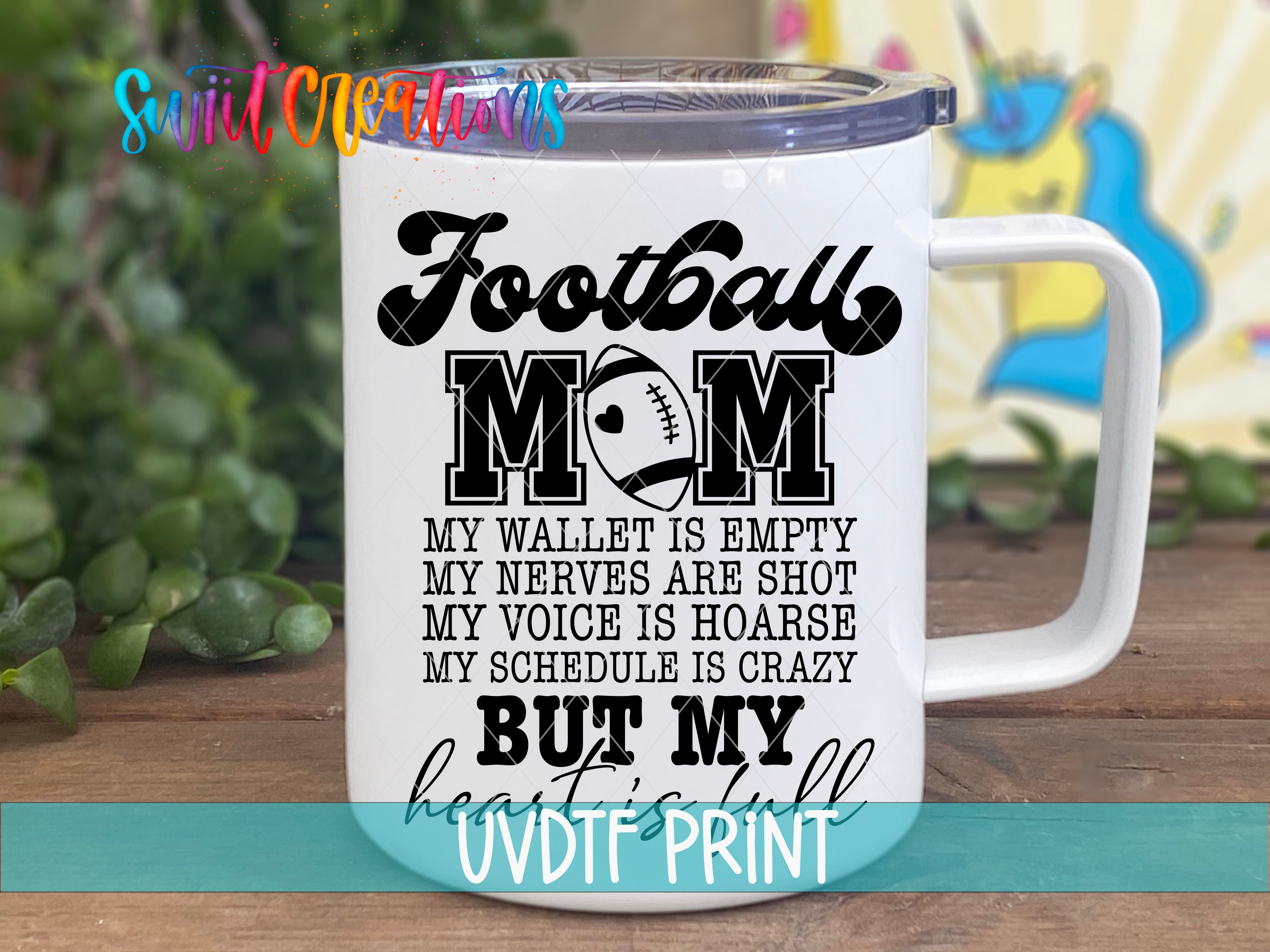 A white mug with text printed on it, placed on a wooden surface.