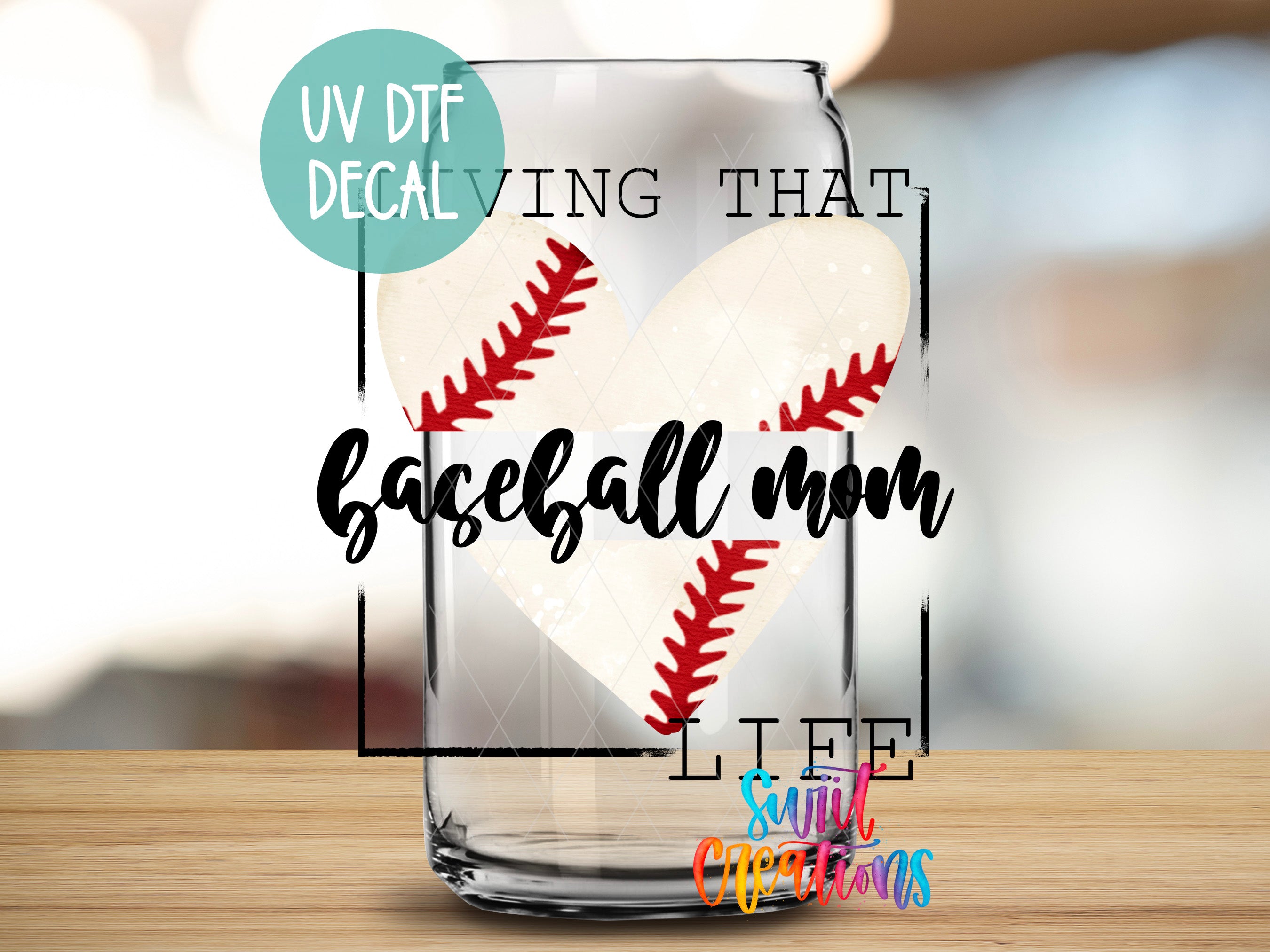 a glass with a baseball heart inside of it
