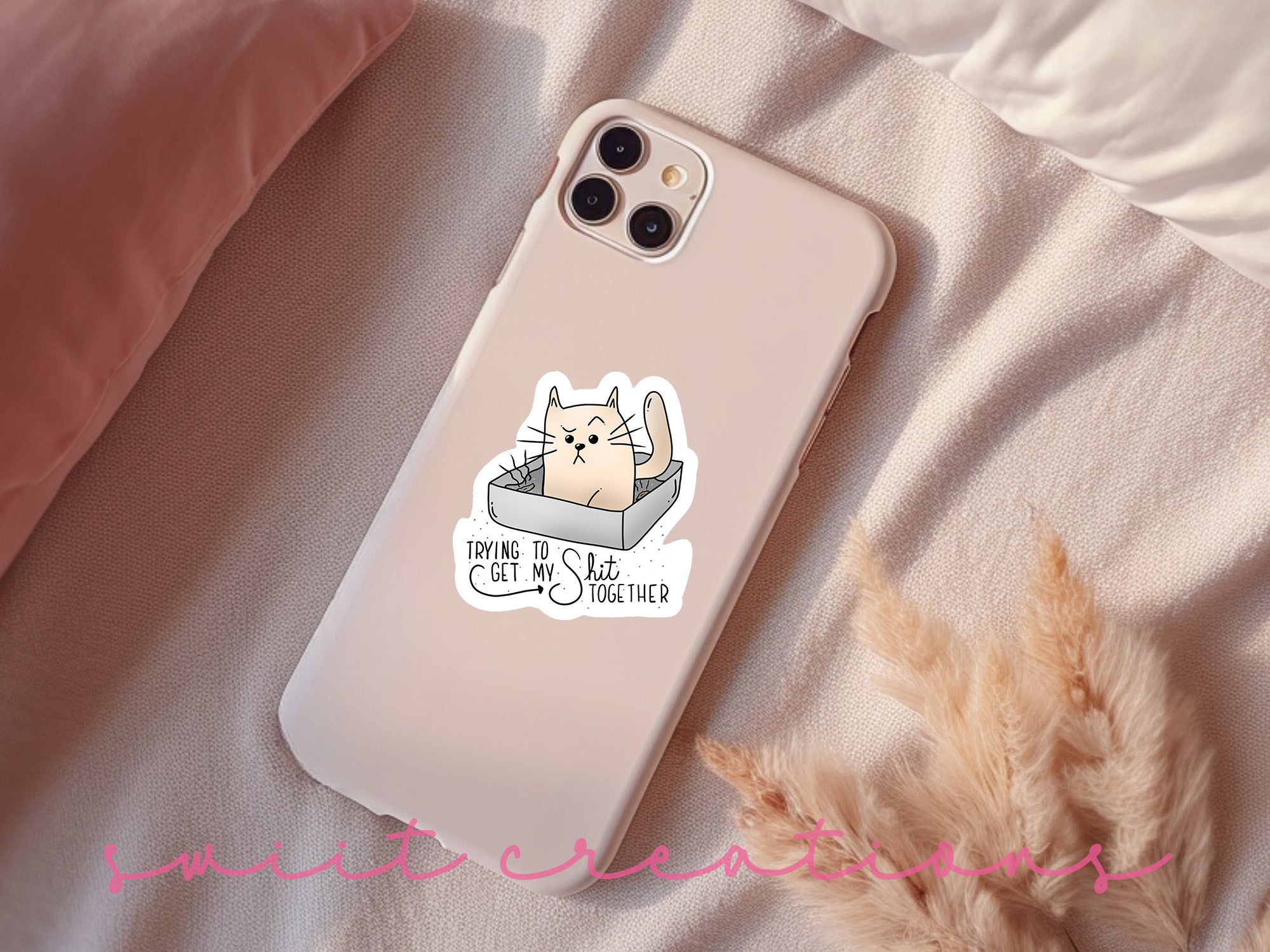 a phone case with a cat sticker on it