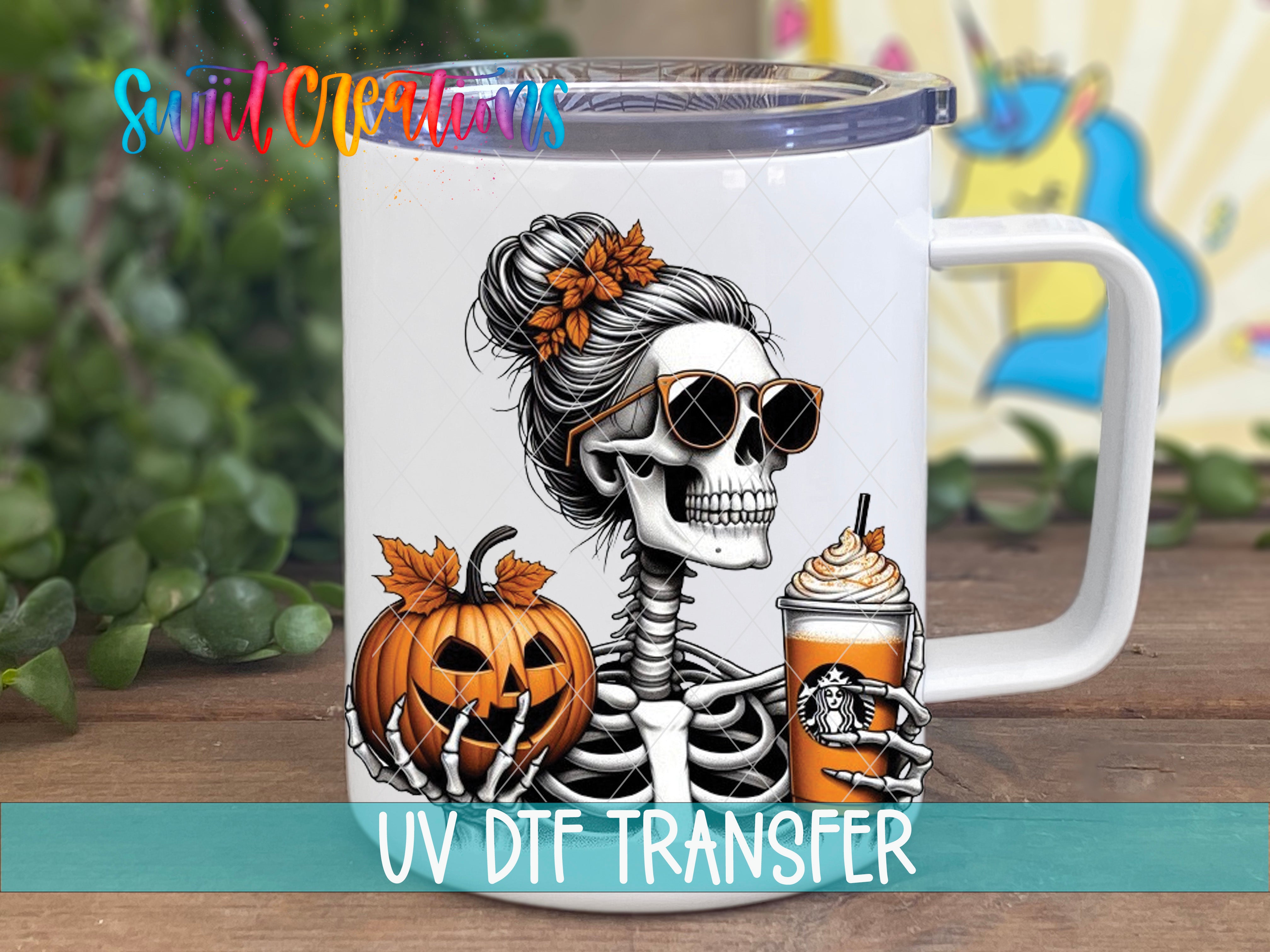 A white mug with a skeleton wearing sunglasses and holding a pumpkin and a Starbucks drink, set against a colorful background.