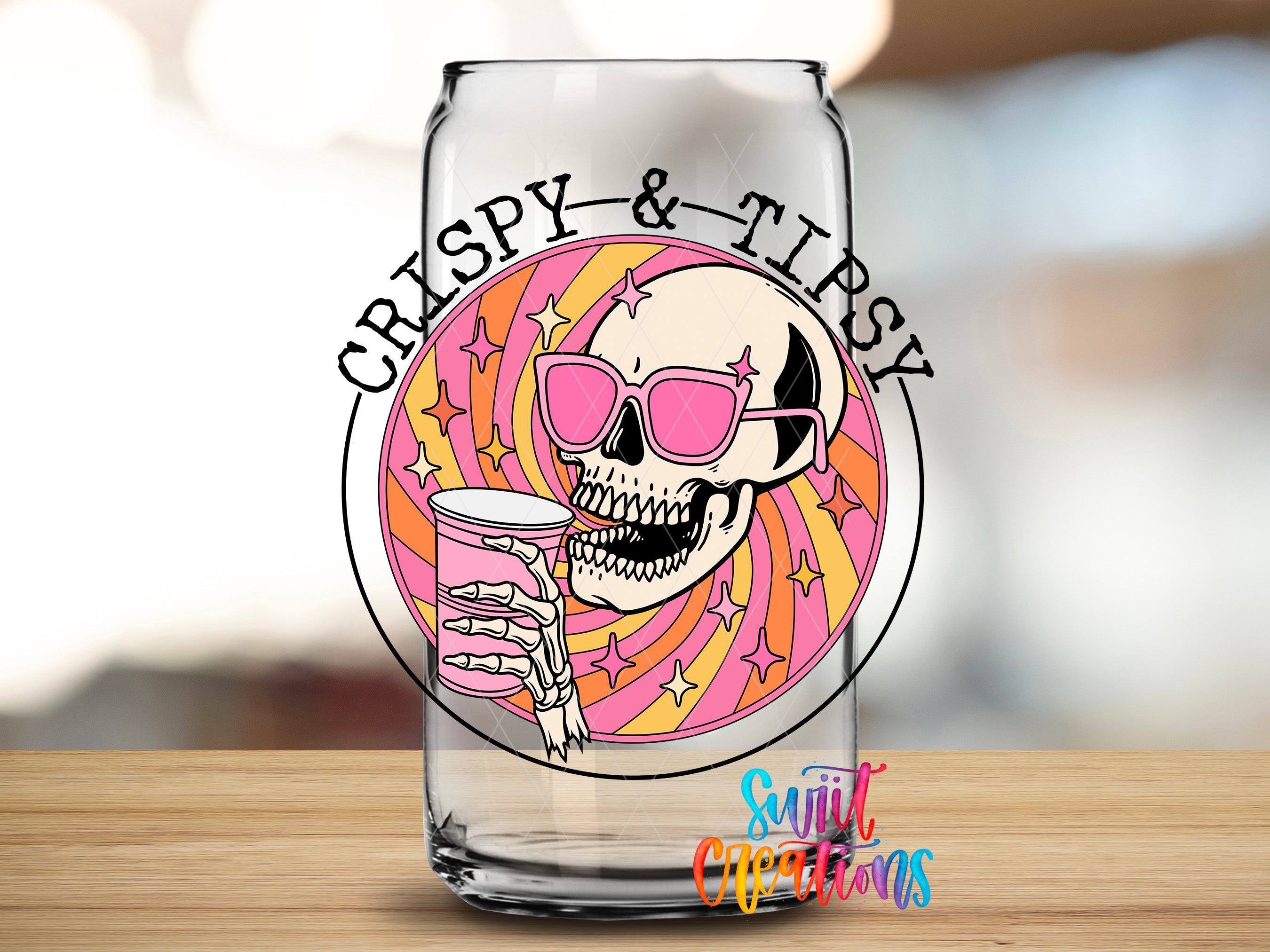 A glass can with a skull wearing sunglasses and holding a drink, surrounded by a colorful, swirling design.