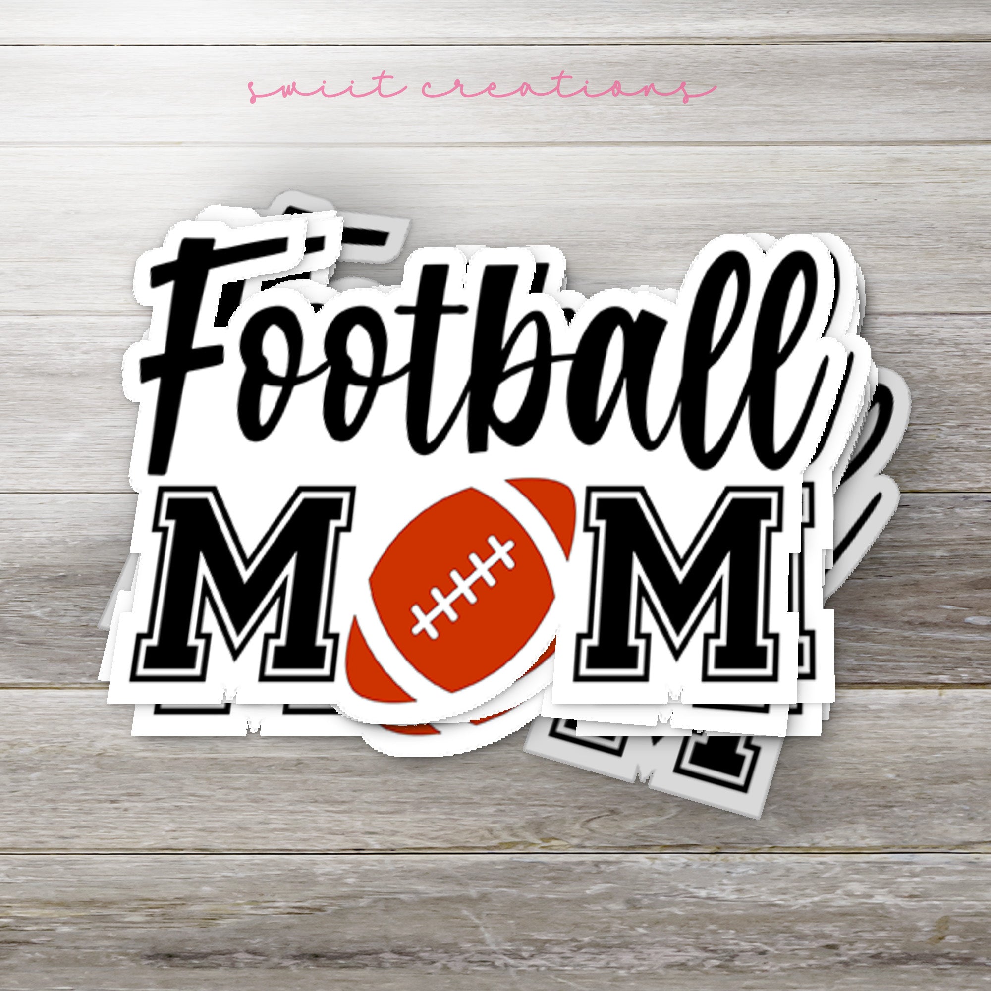 a football mom sticker on a wooden surface