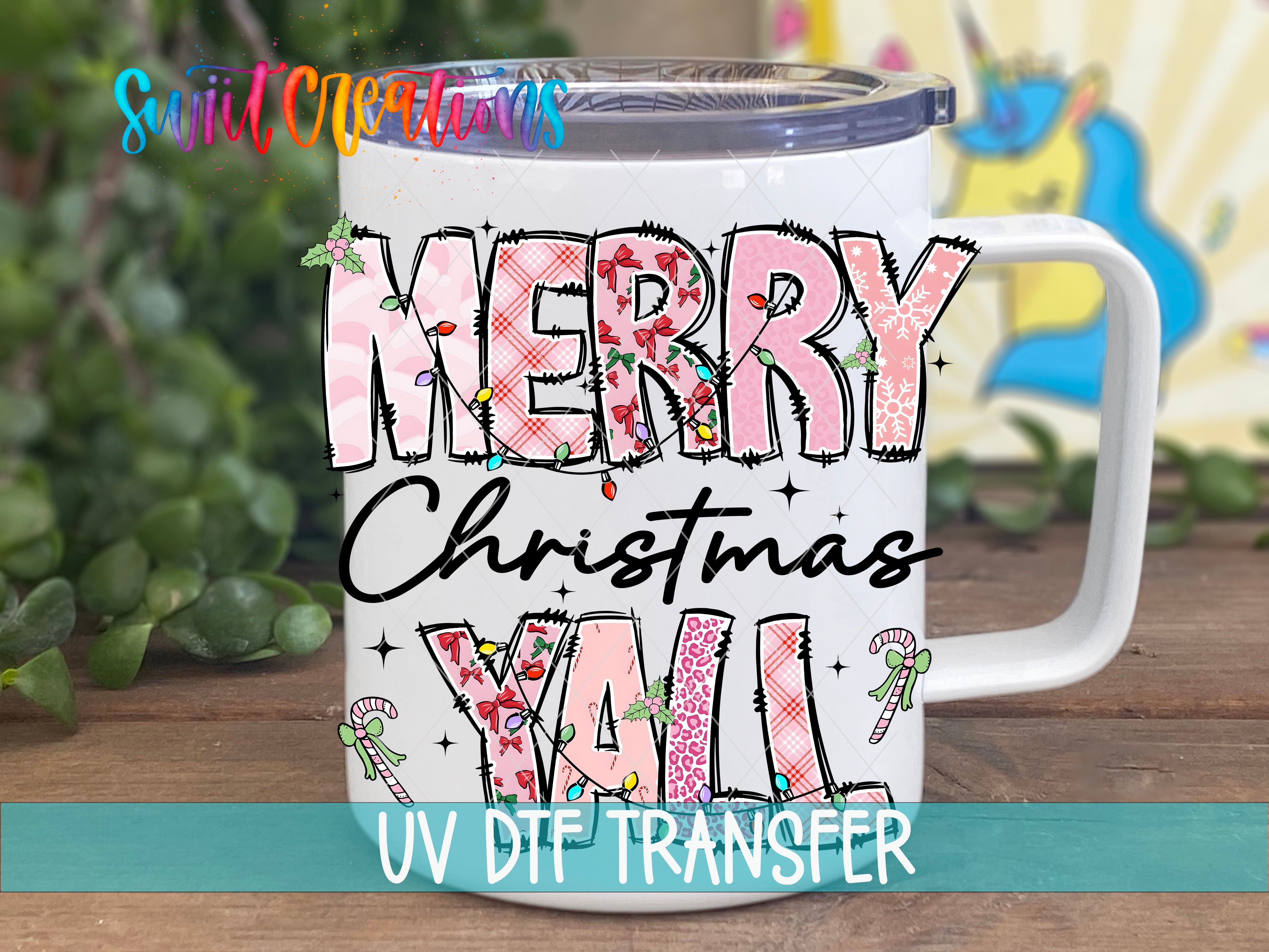 A white mug with a colorful, hand-drawn design that says "MERRY CHRISTMAS YALL" in pink and black text.