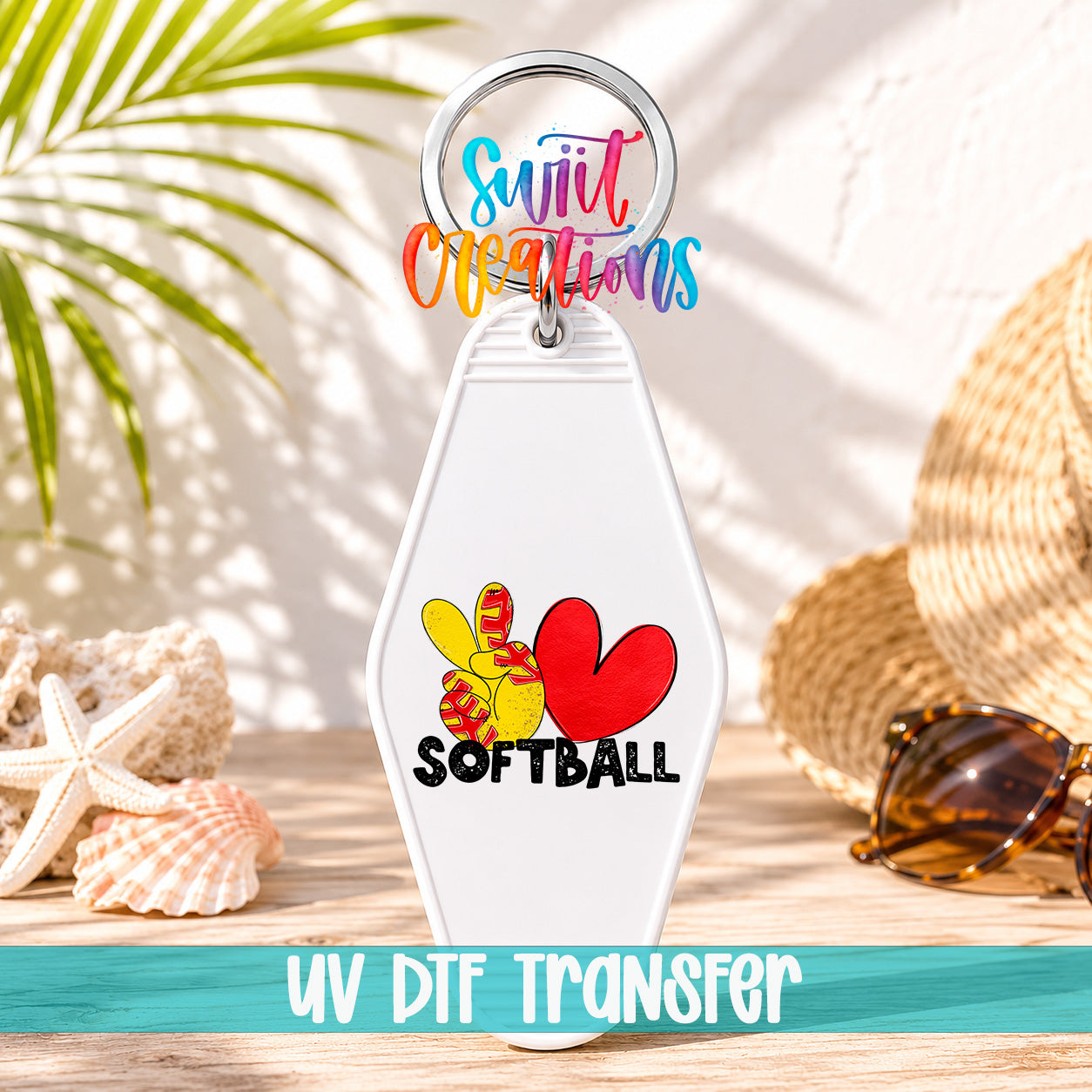 A keychain with a colorful design featuring a heart and a soccer ball, along with the text "Softball" and a tagline "UV DFT Transfers".