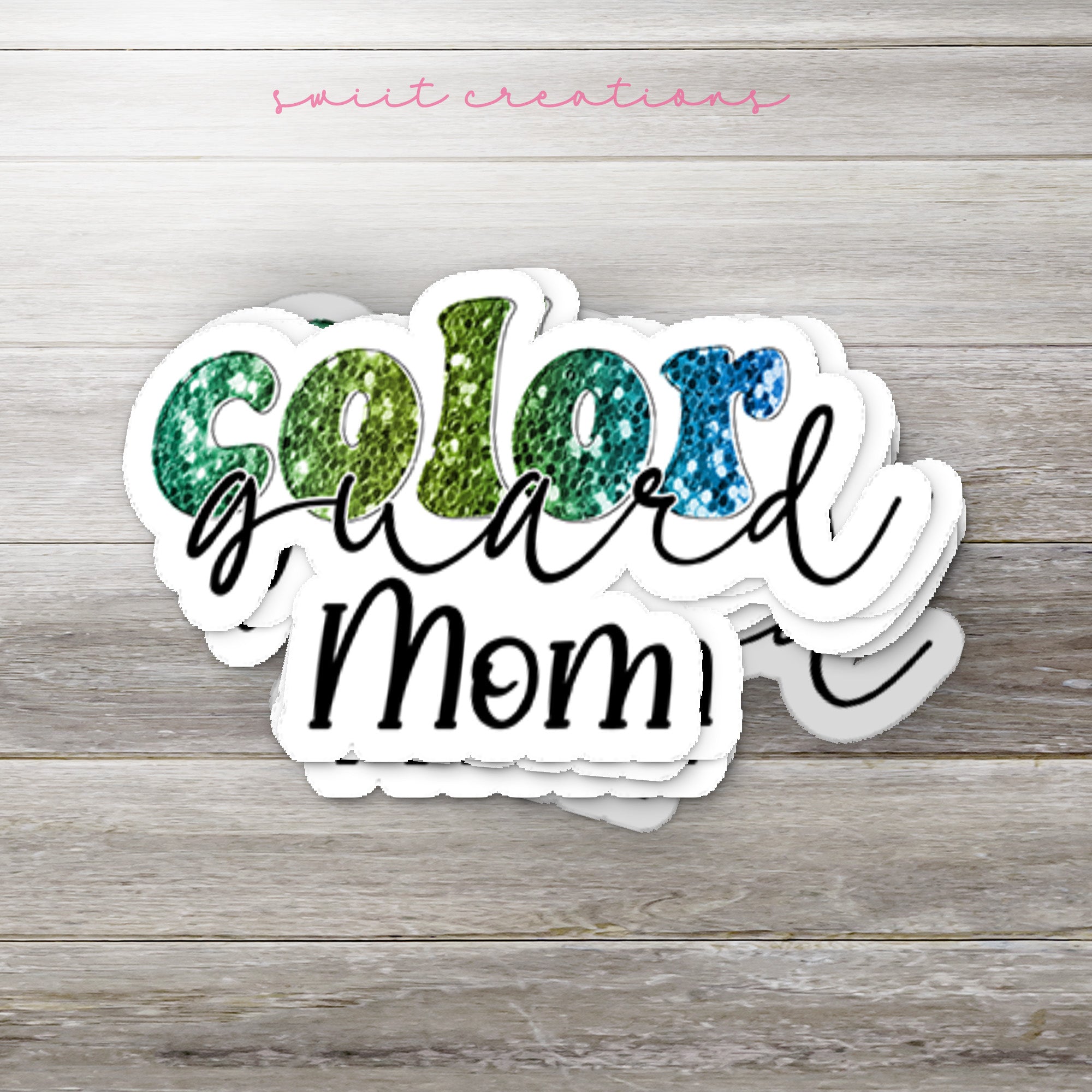 a close up of a sticker on a wooden surface