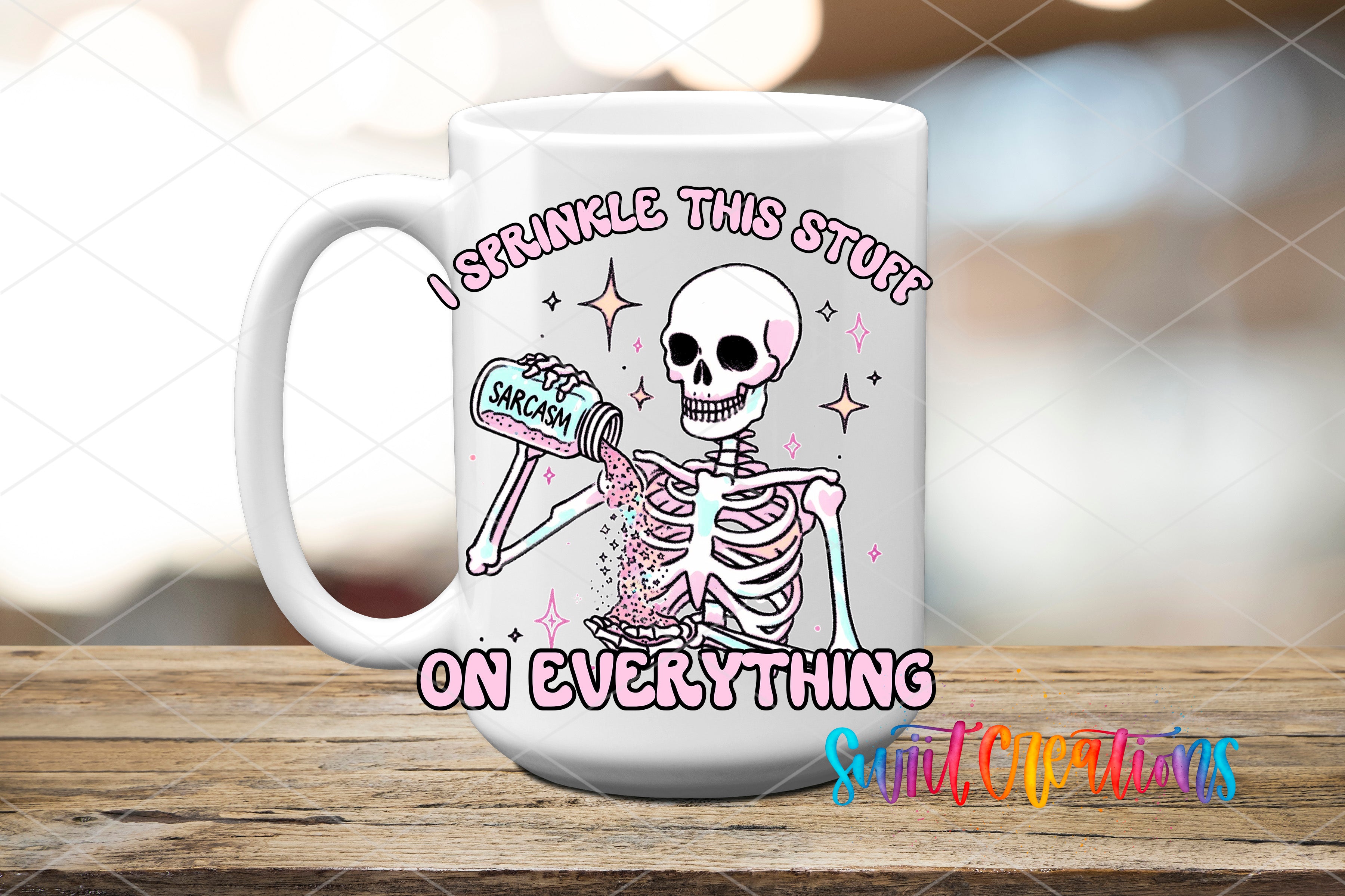A white ceramic mug with a cartoon skeleton holding a jar of something, surrounded by stars and text that reads "I sprinkle this stuff on everything".