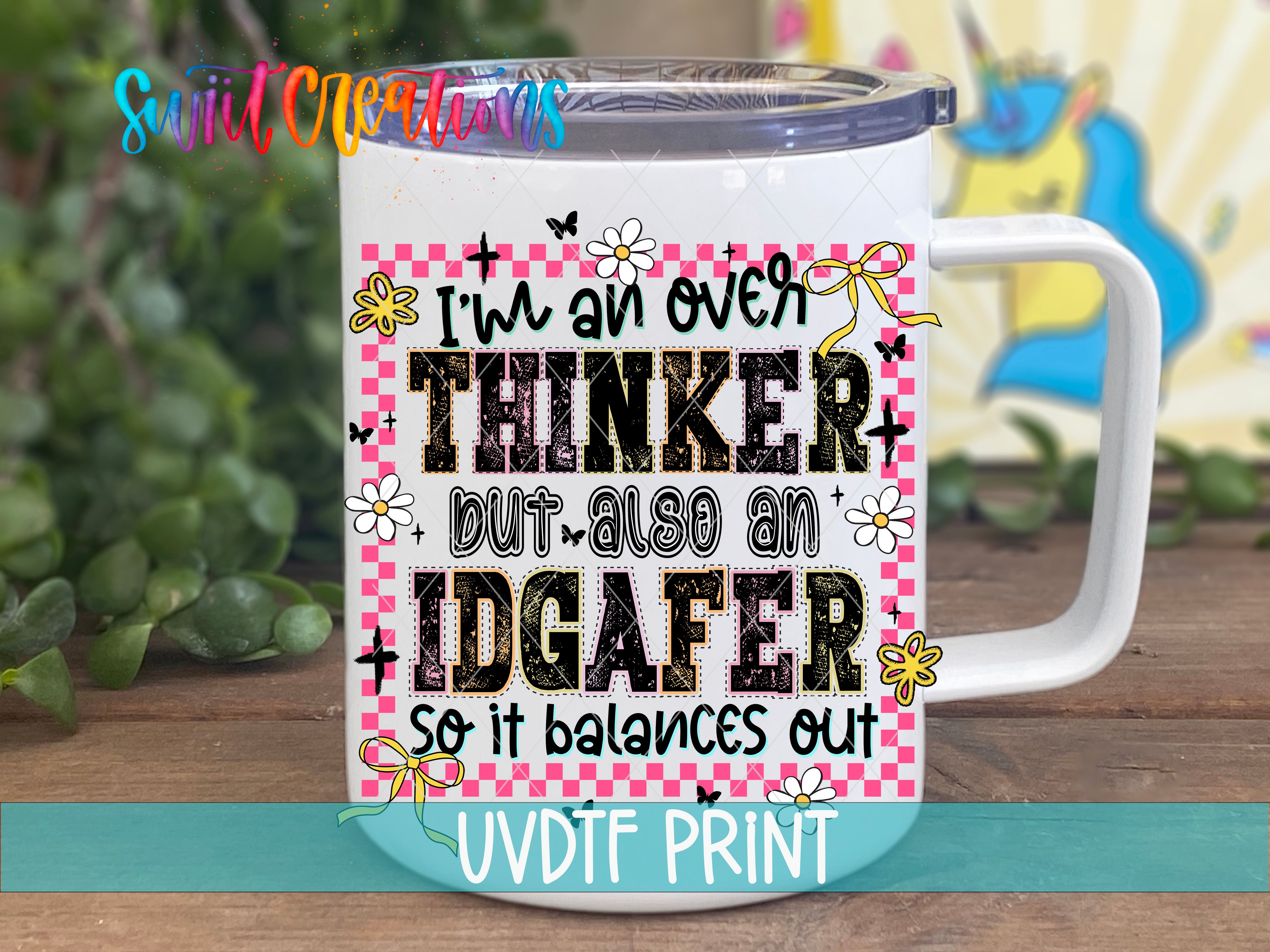 A white mug with a colorful and playful design featuring text and illustrations.