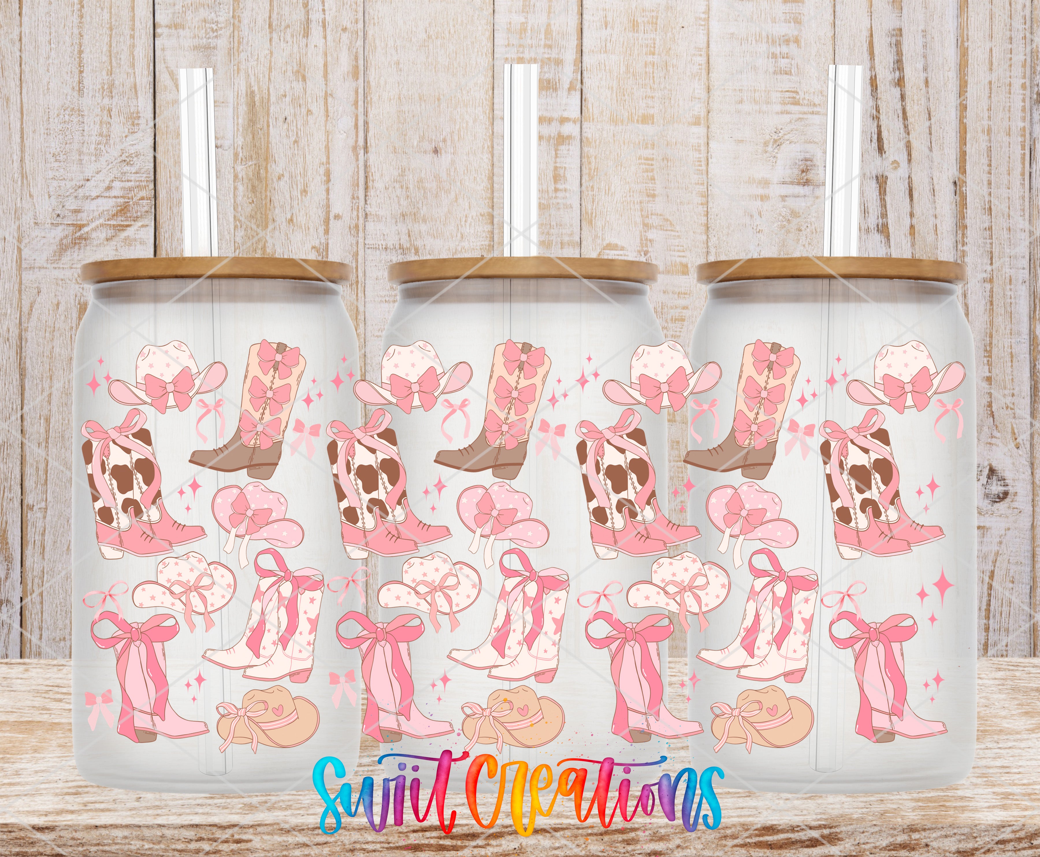 three glass tumblers with a repeating pattern of pink cowboy boots and bows on a white background.