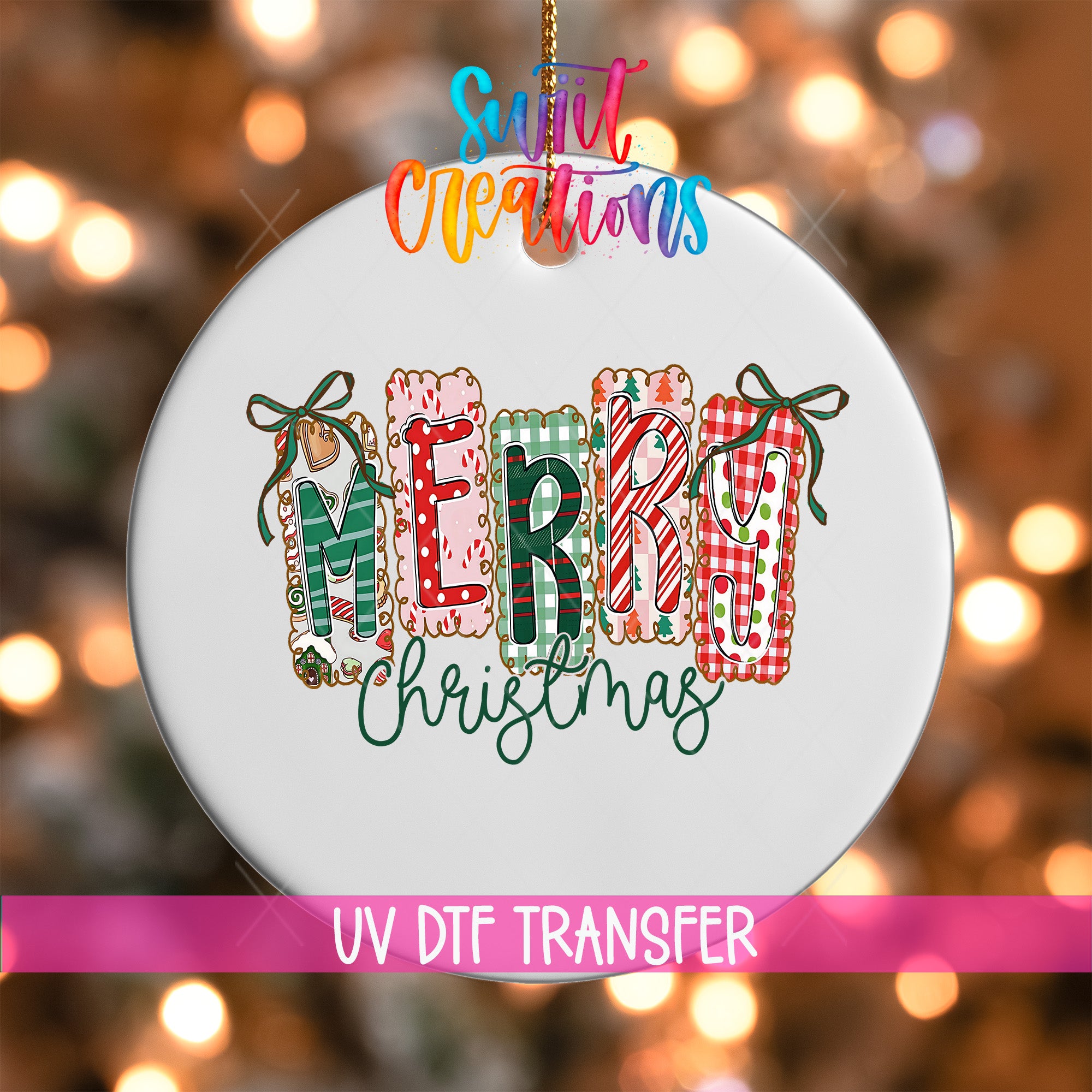 A white ornament with the word "MERRY CHRISTMAS" written on it, surrounded by colorful decorative elements.