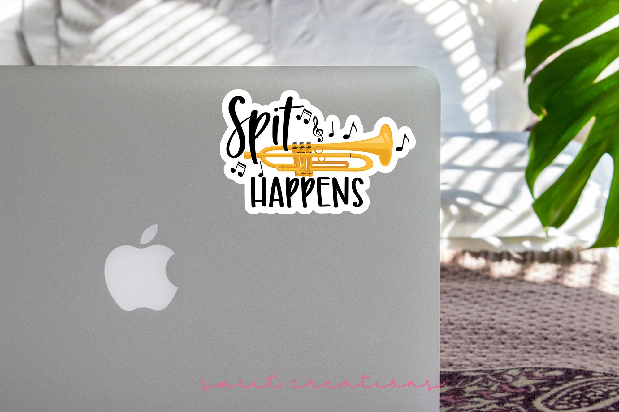 a laptop with a sticker that says spit happens