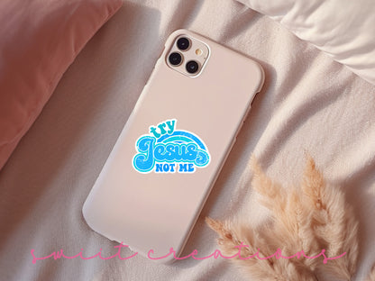 a phone case with a sticker on it sitting on a bed