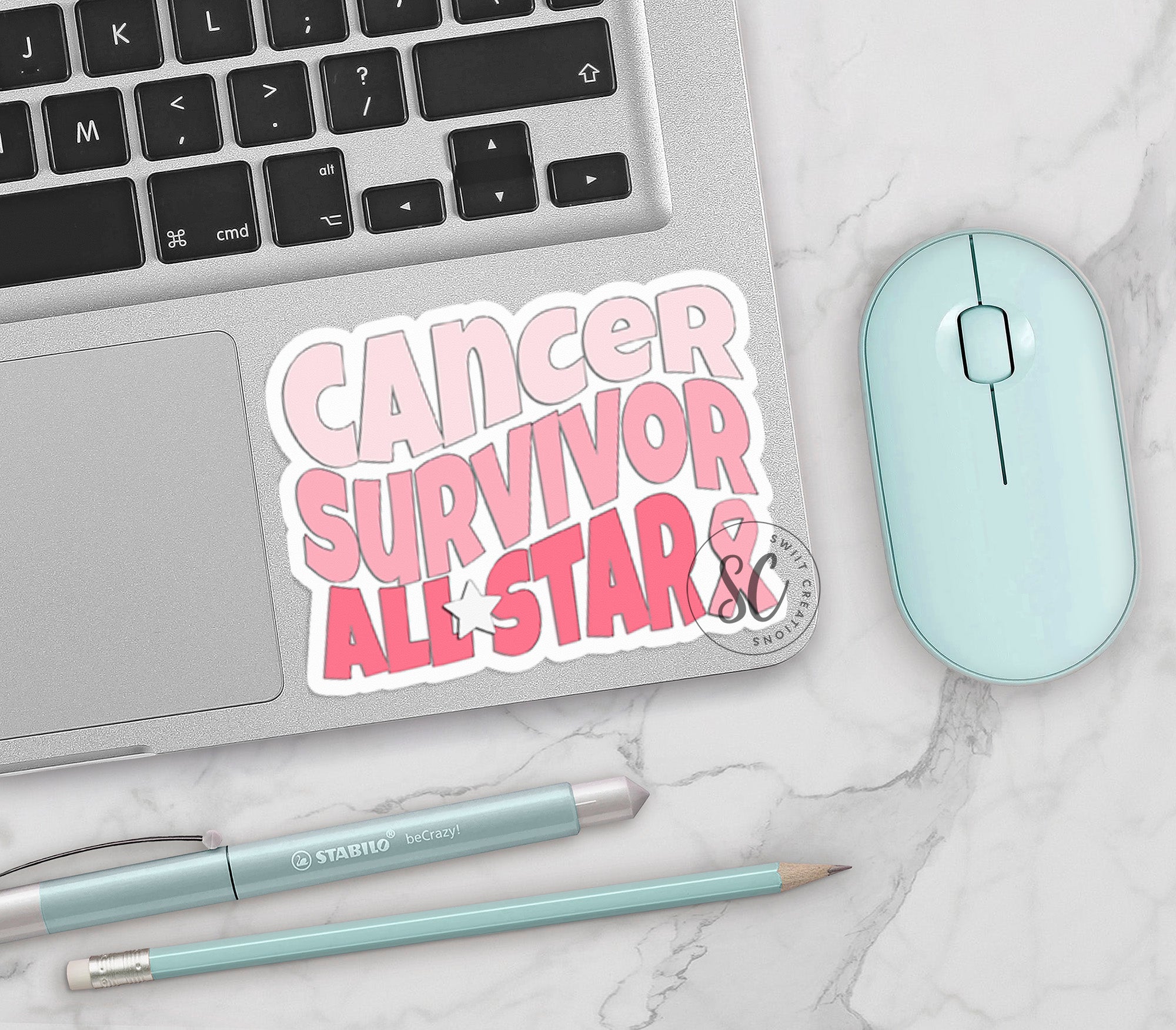 a laptop computer sitting on top of a white table