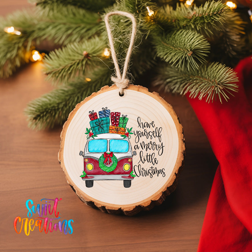 A wooden ornament with a vintage van and Christmas presents hanging on a Christmas tree.