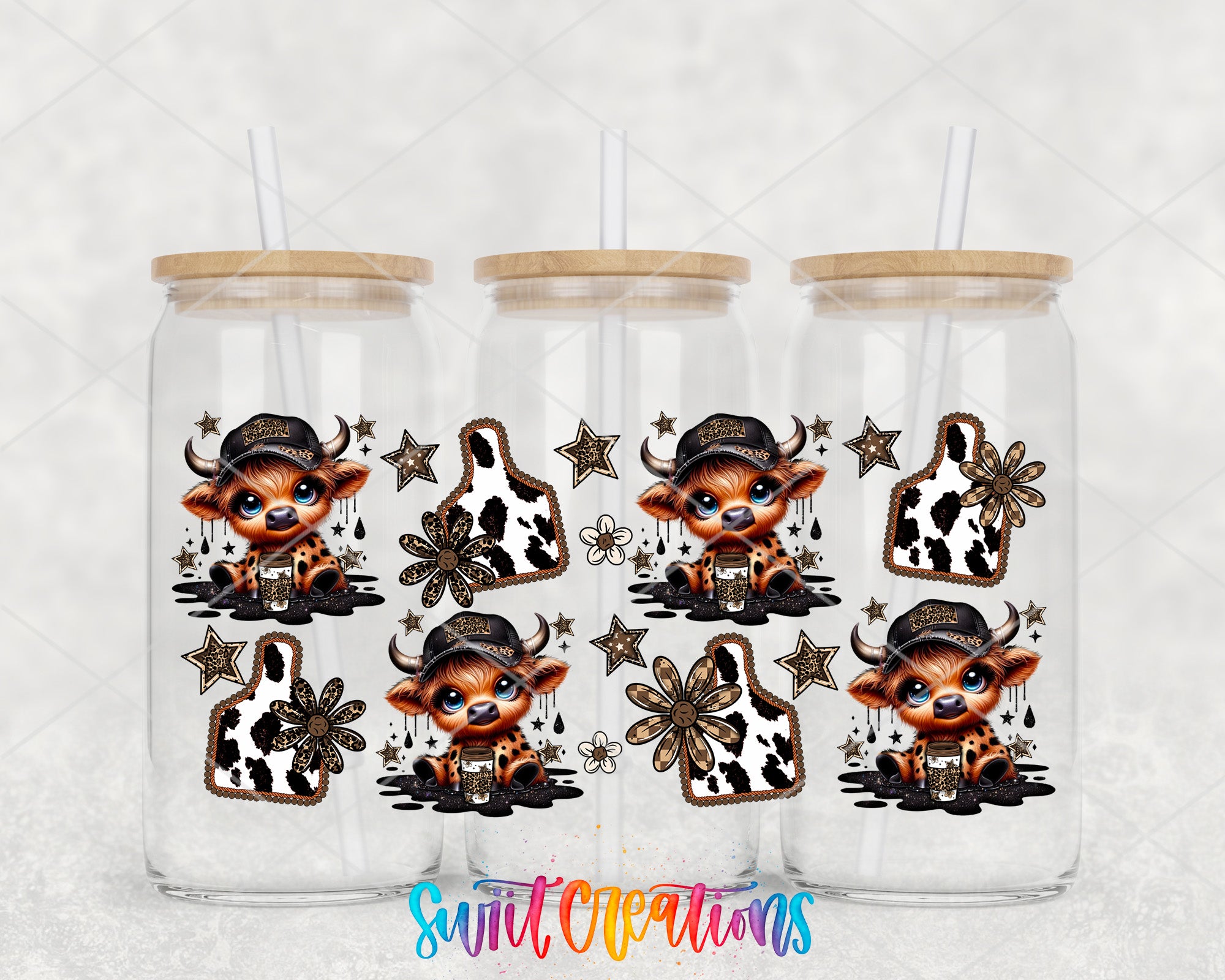 three glass tumblers with cow-themed designs on them.