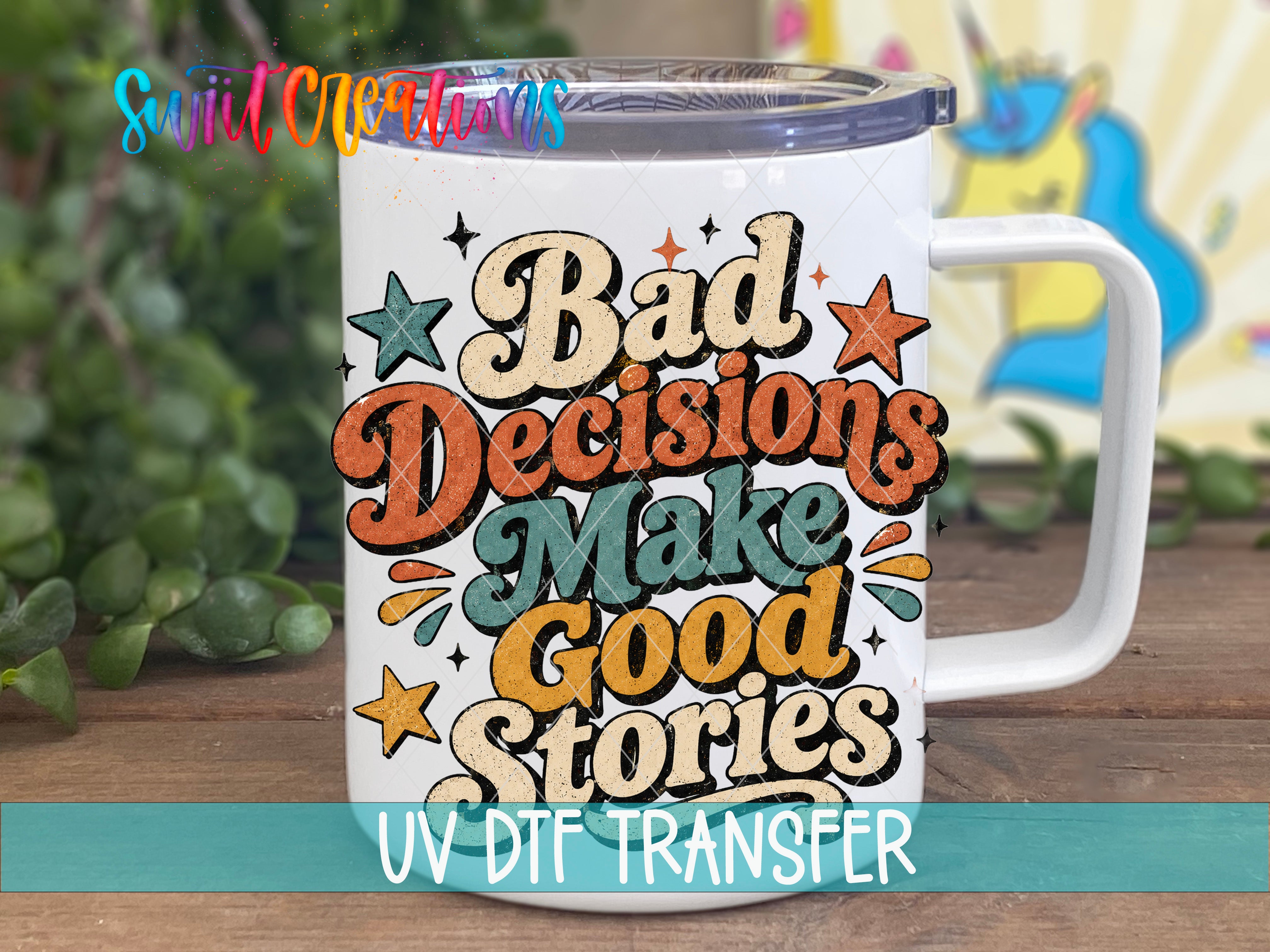A white mug with a colorful design featuring the text "Bad Decisions Make Good Stories" and various stars and shapes.