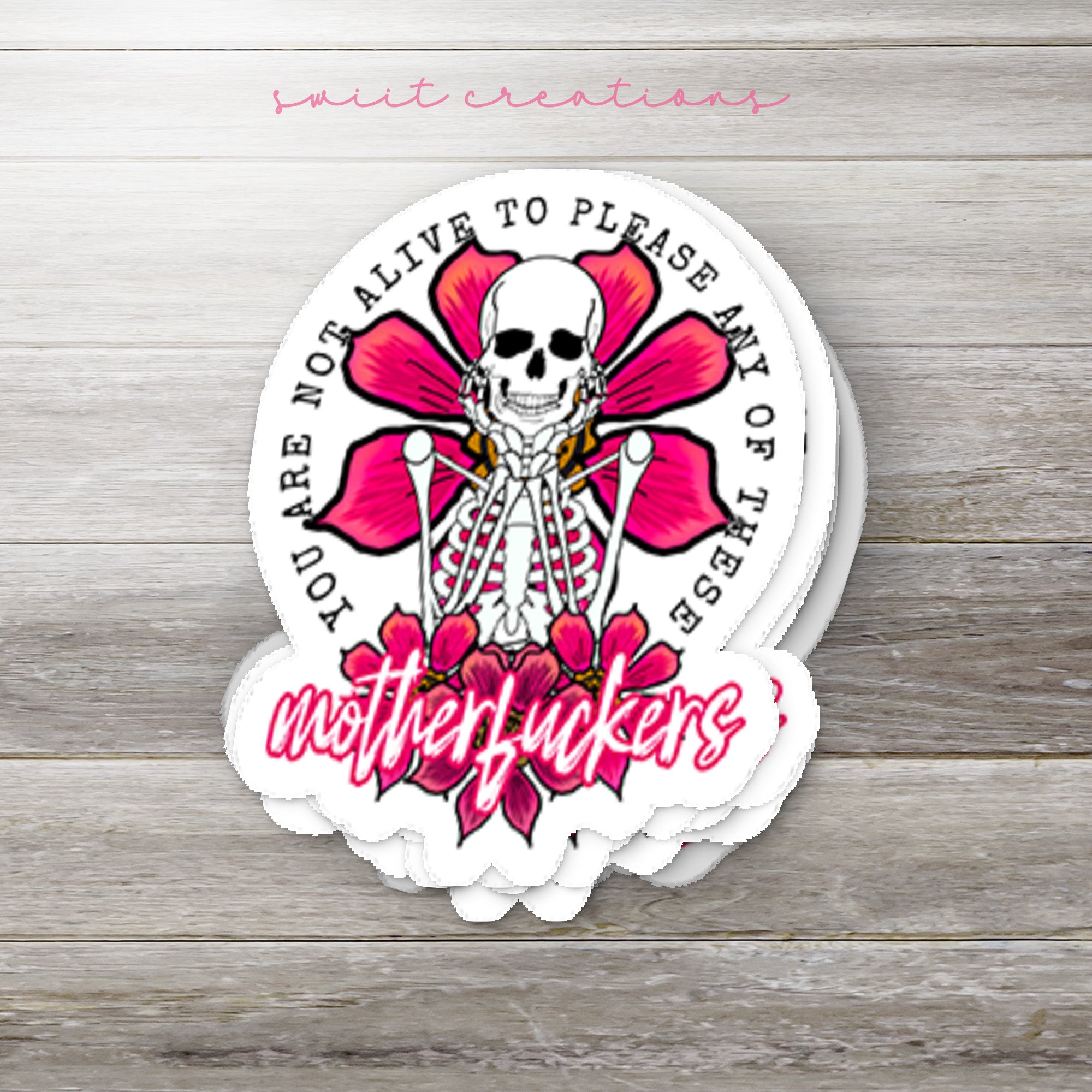 a sticker with a skull and a flower on it