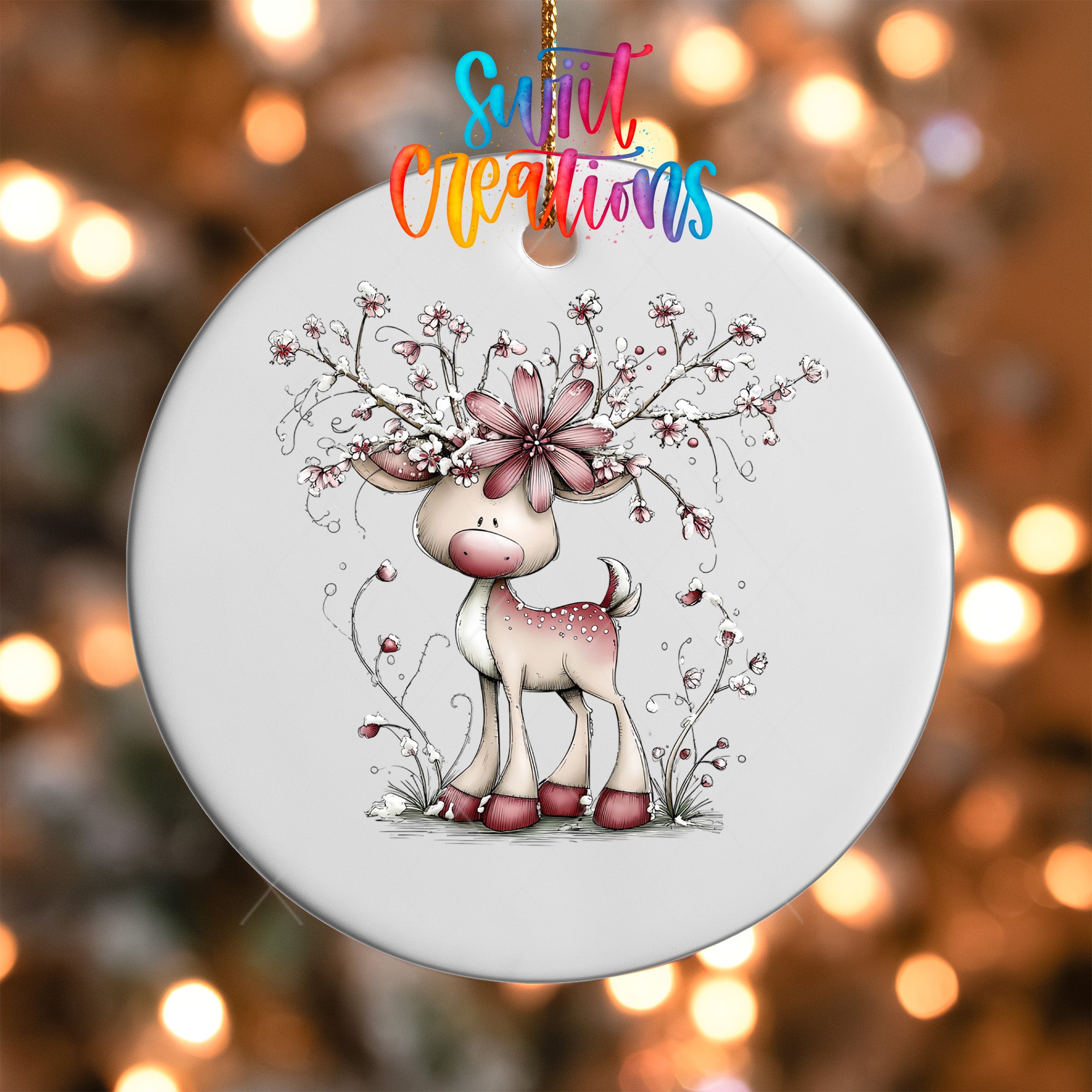 A white ceramic ornament featuring a whimsical illustration of a deer with a flower on its head, surrounded by flowers and branches.