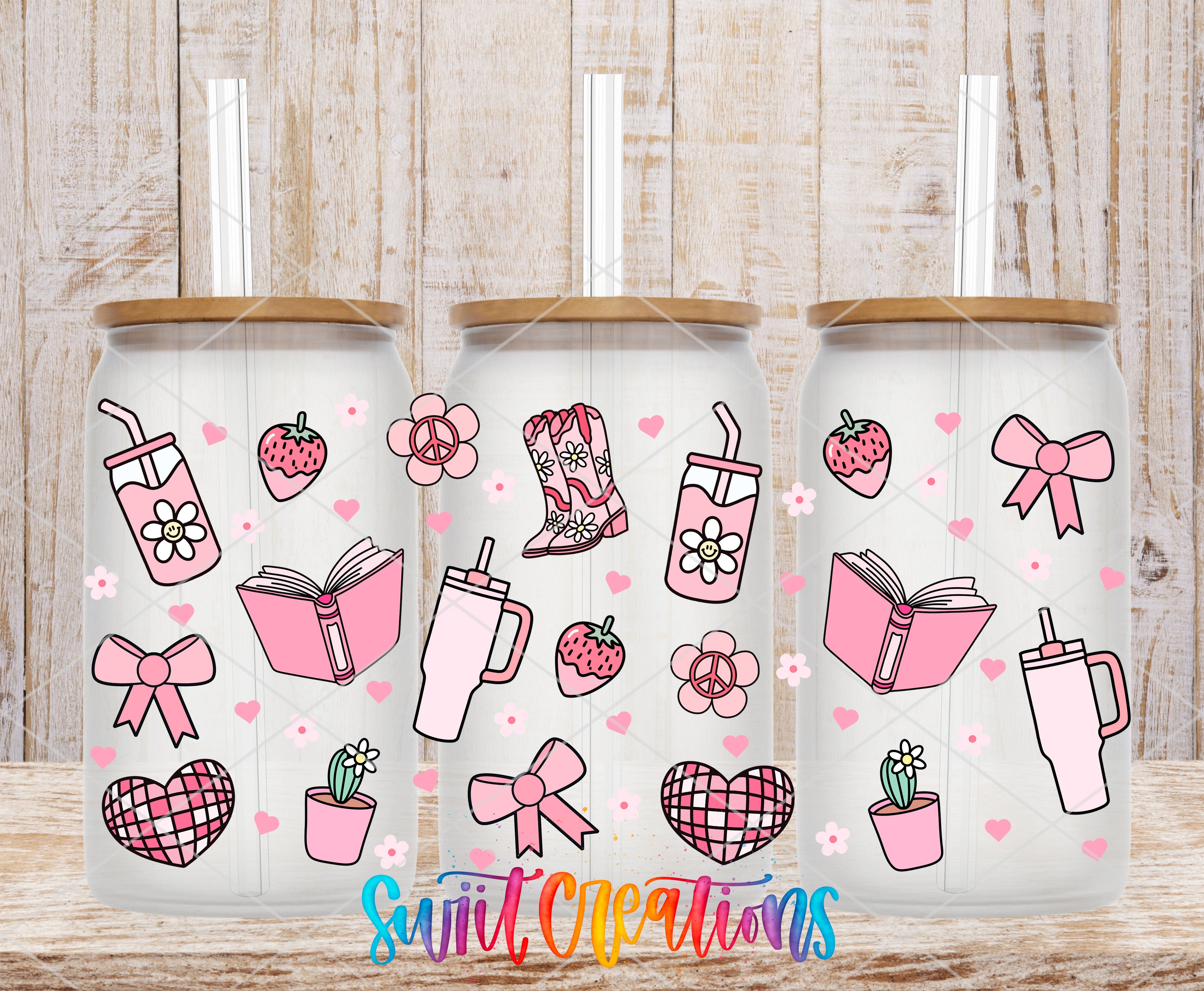 three glass tumblers with various pink and white illustrations on them, including a book, a cup, a heart, a bow, a strawberry, and a peace sign.