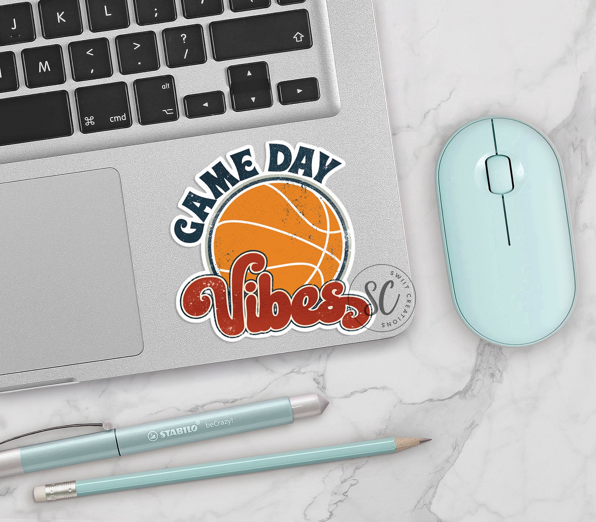 a laptop computer sitting next to a mouse