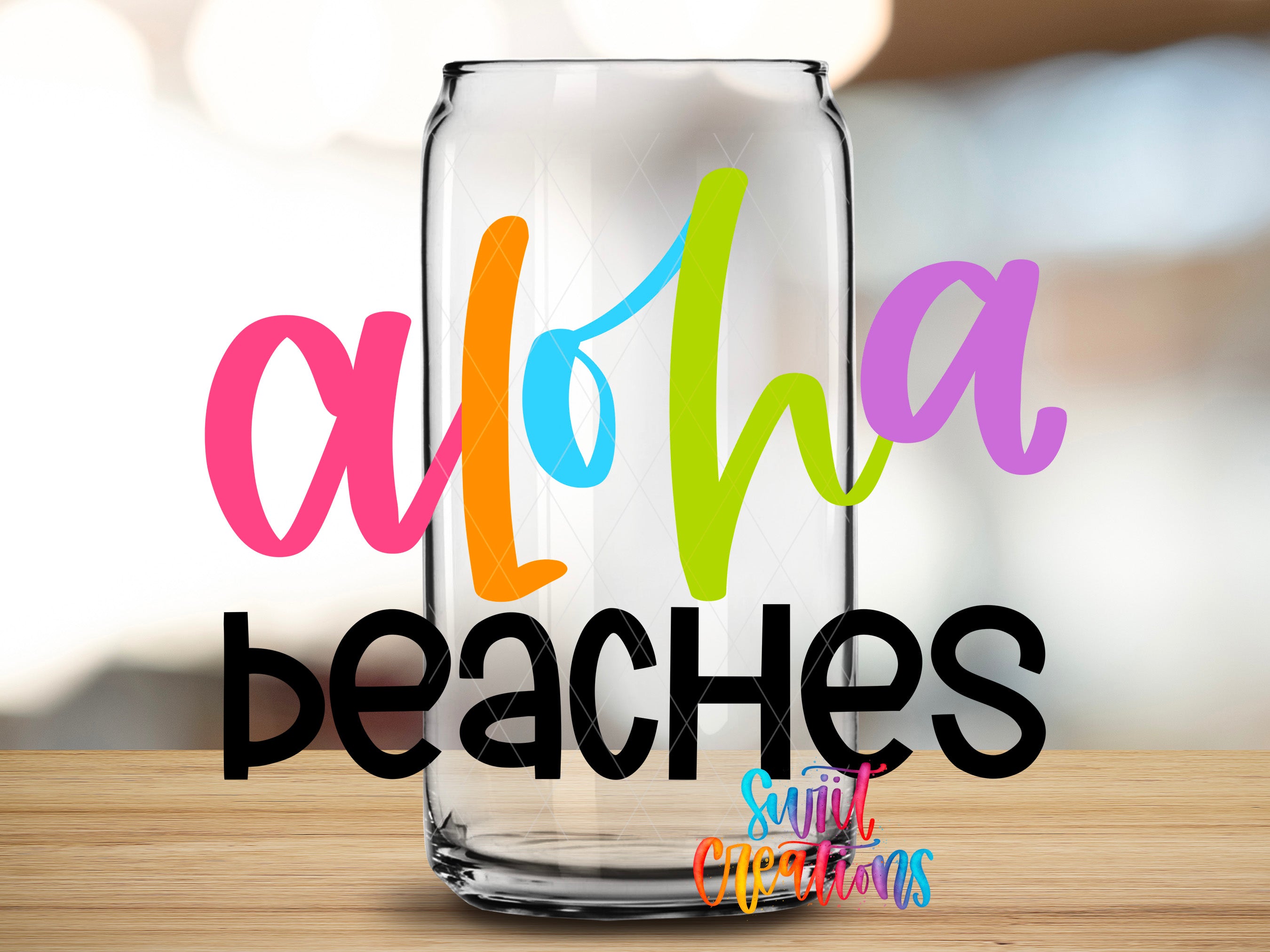 A glass can with the text "Aloha Peaches" written on it, along with a colorful, abstract design.