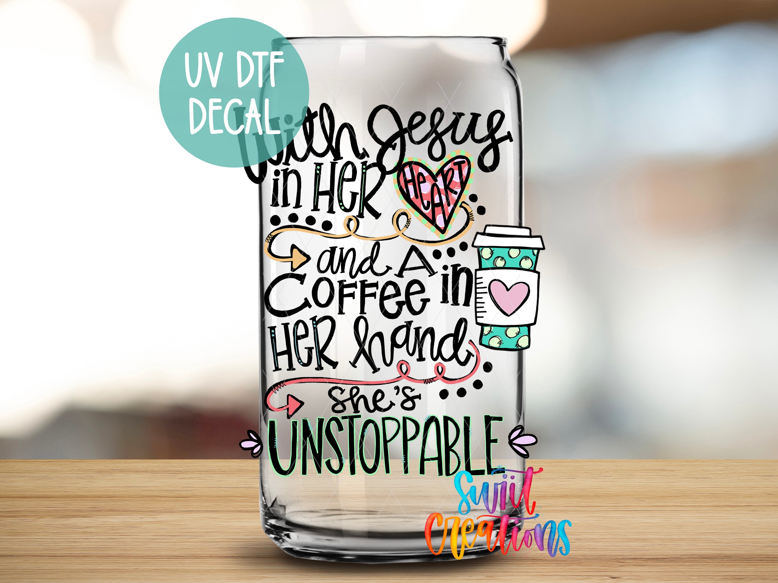 a glass with some writing on it sitting on a table