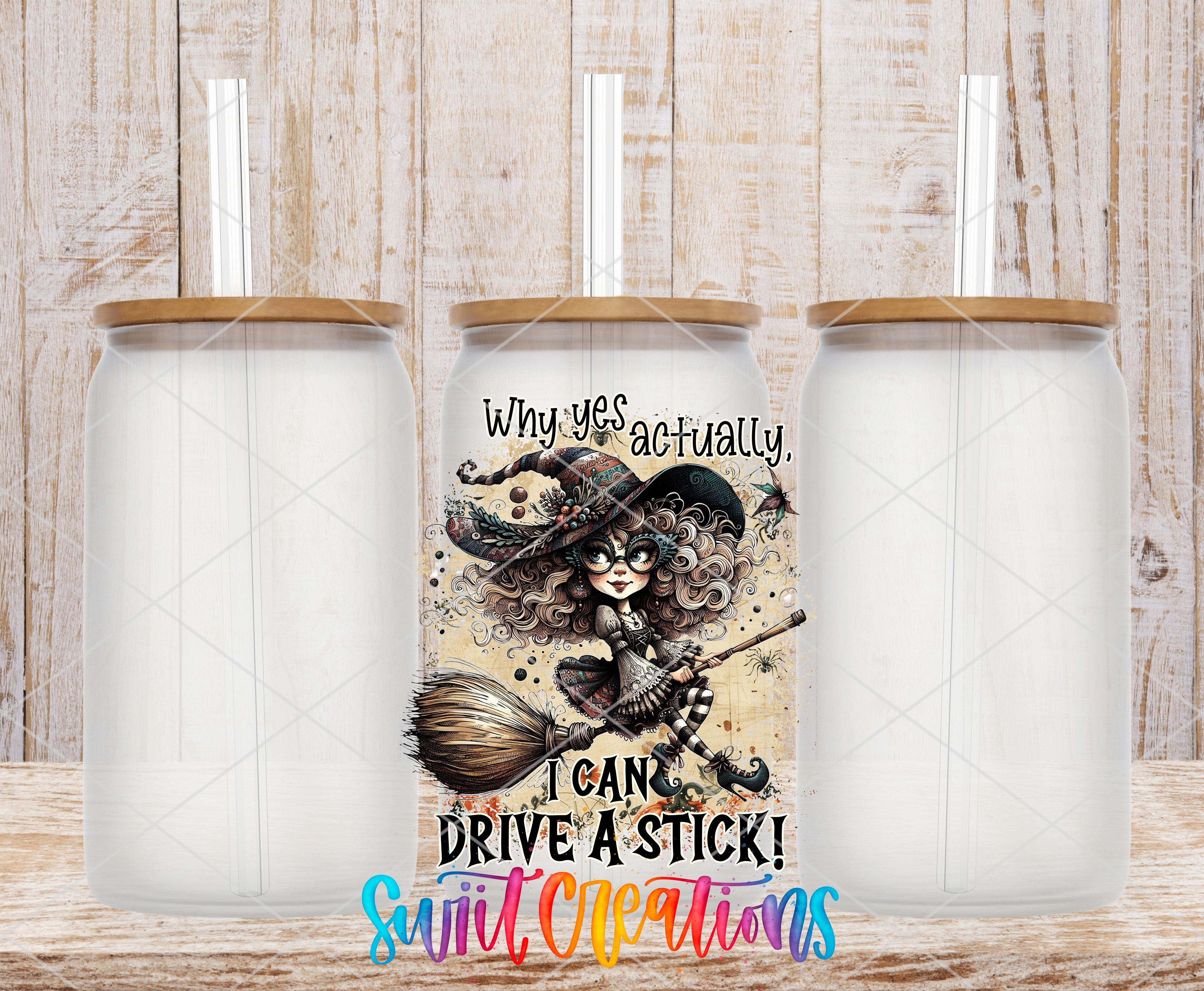 a clear glass tumbler with a printed design on it, including a witch character and text.
