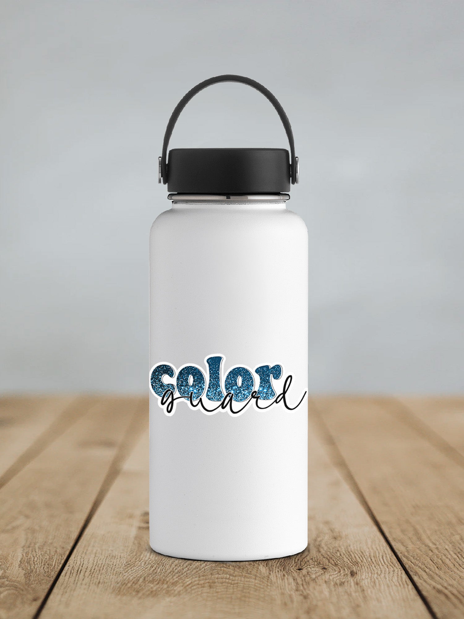 a white water bottle sitting on top of a wooden table