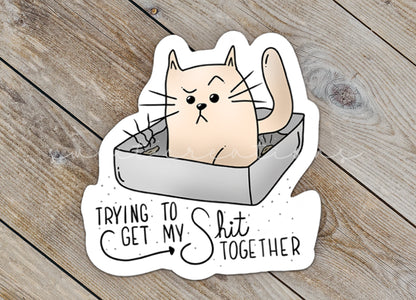 a sticker that says trying to get my shit together
