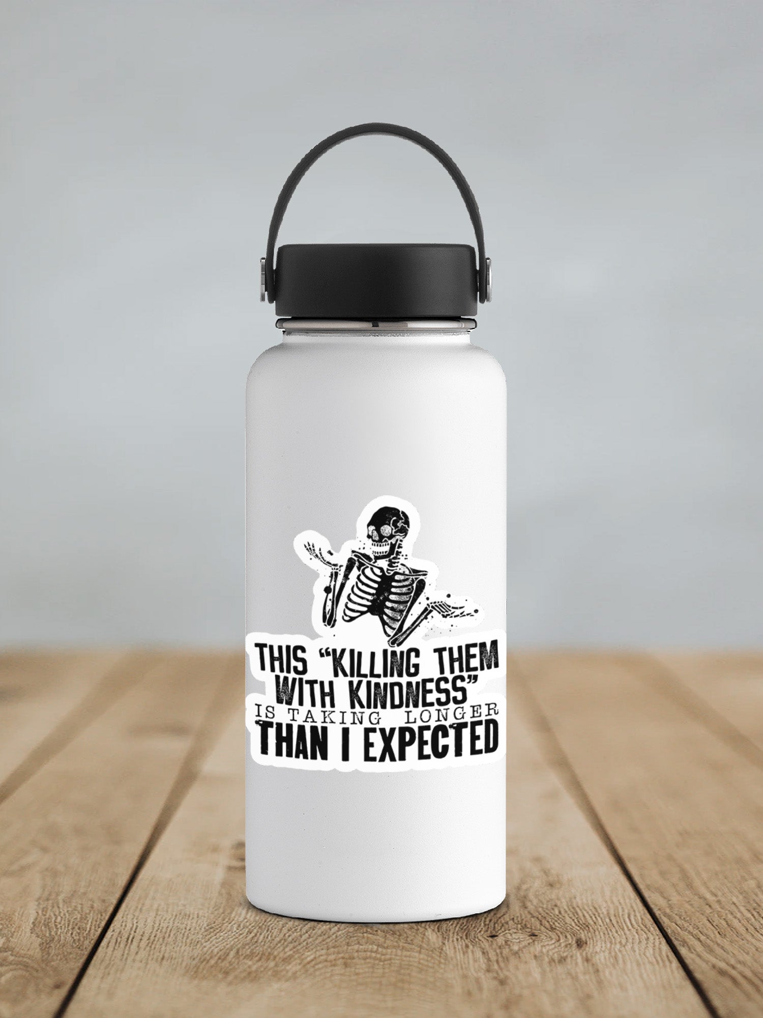 a white water bottle sitting on top of a wooden table