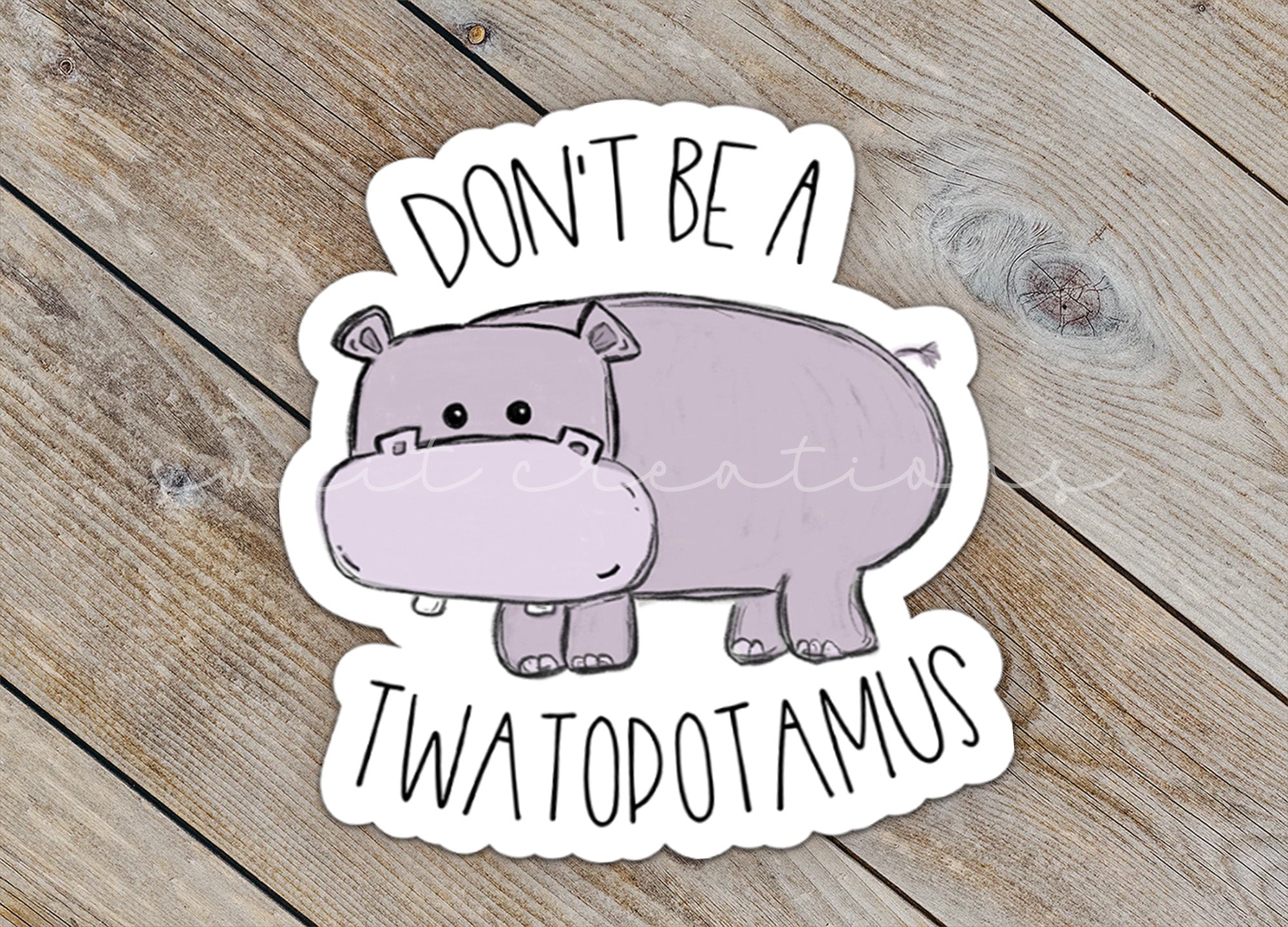 a sticker of a hippo with the words don't be a two
