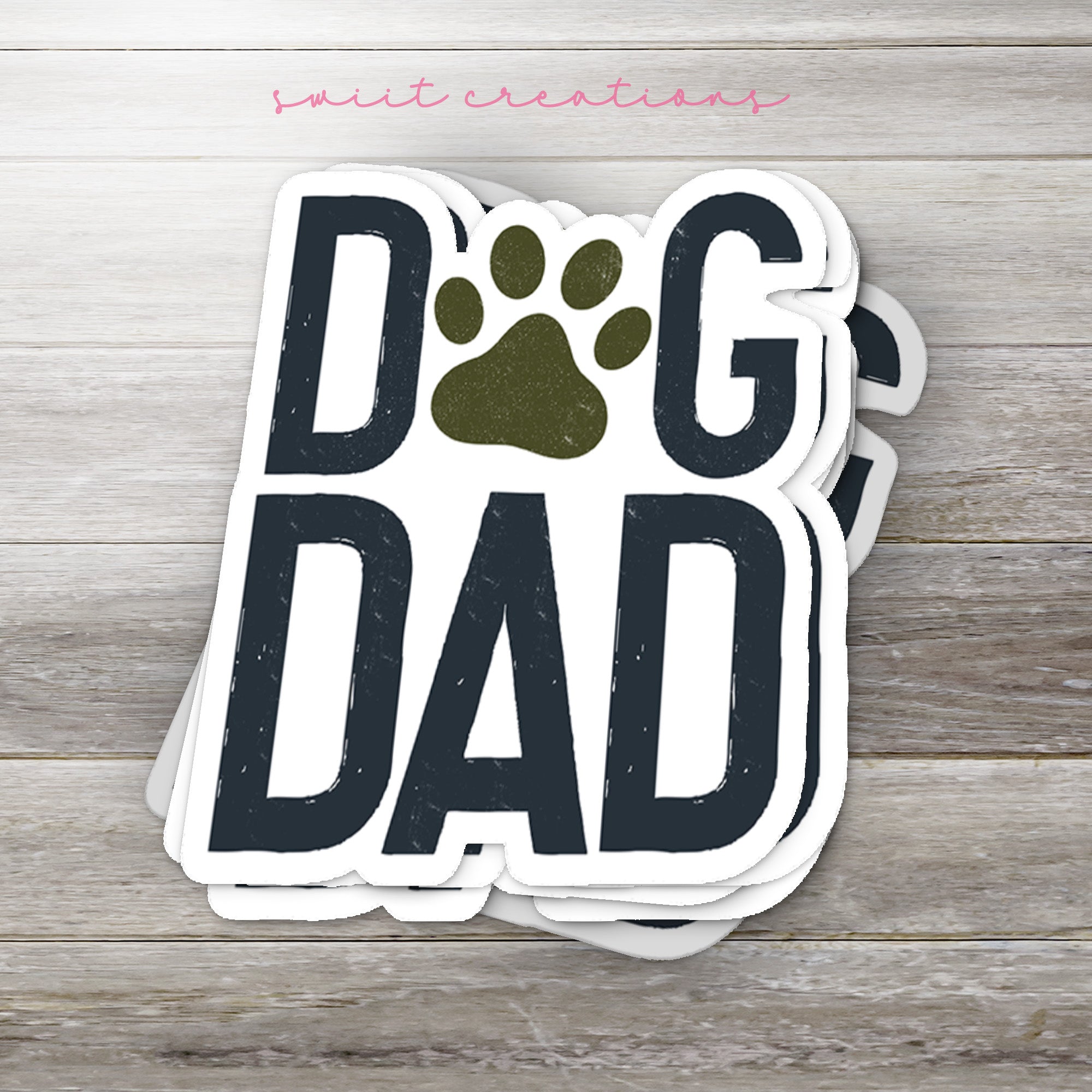 a sticker that says dog dad with a paw on it