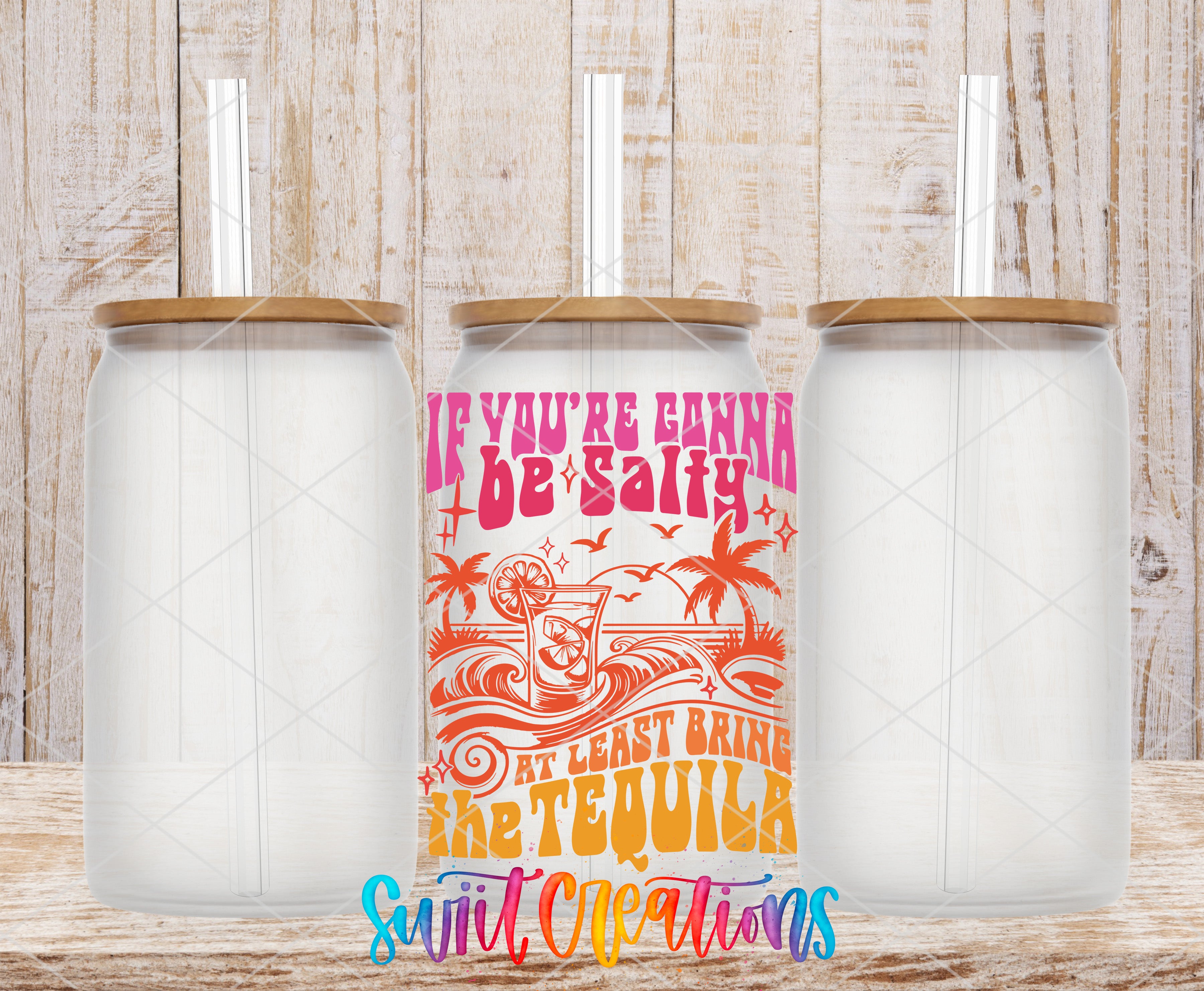 A colorful can of tequila with a straw, placed between two empty glass jars on a wooden surface.