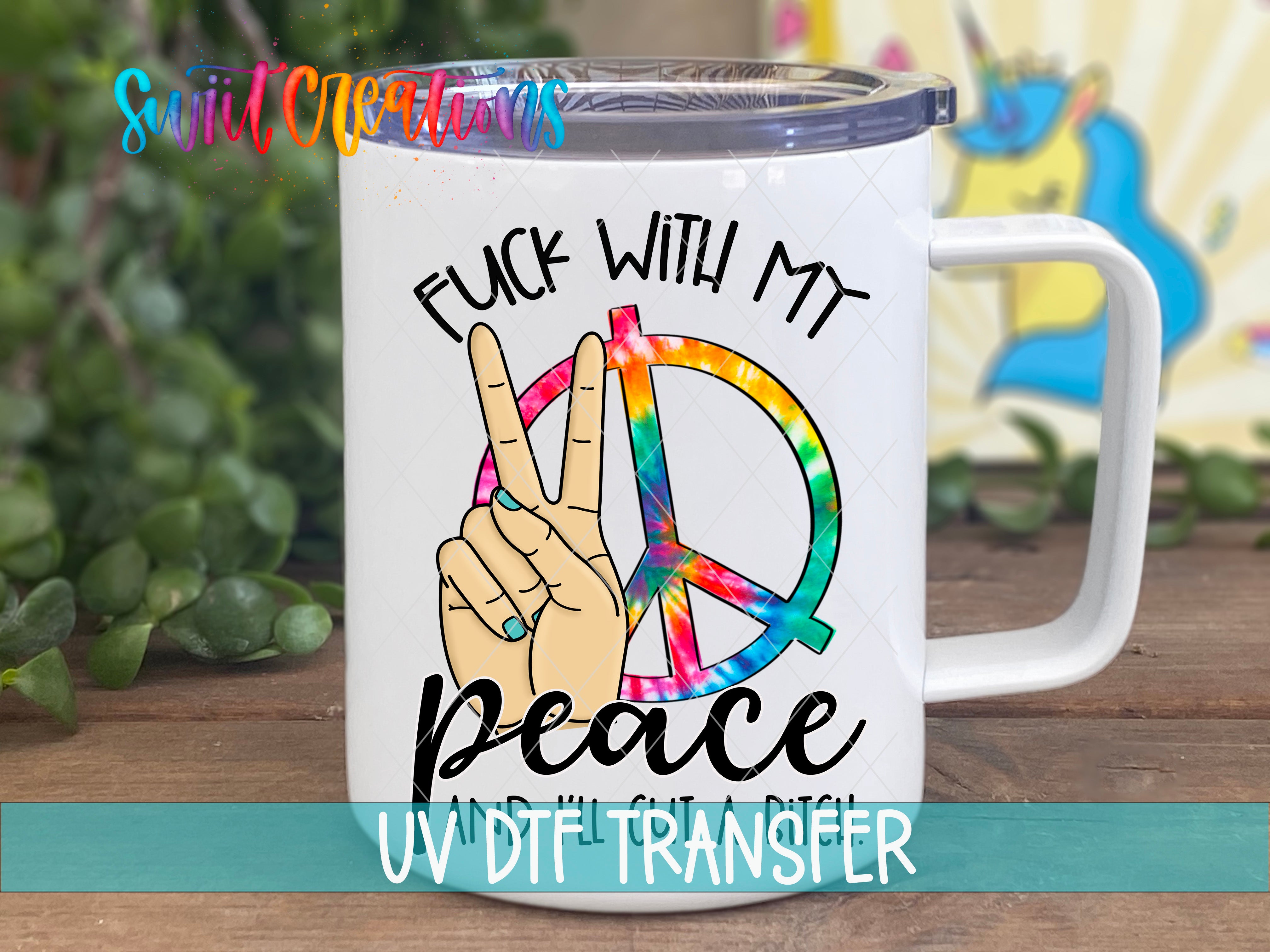 A white ceramic mug with a peace sign and the text "FUCK WITH MY PEACE AND IT'S GET A BITCH" printed on it.