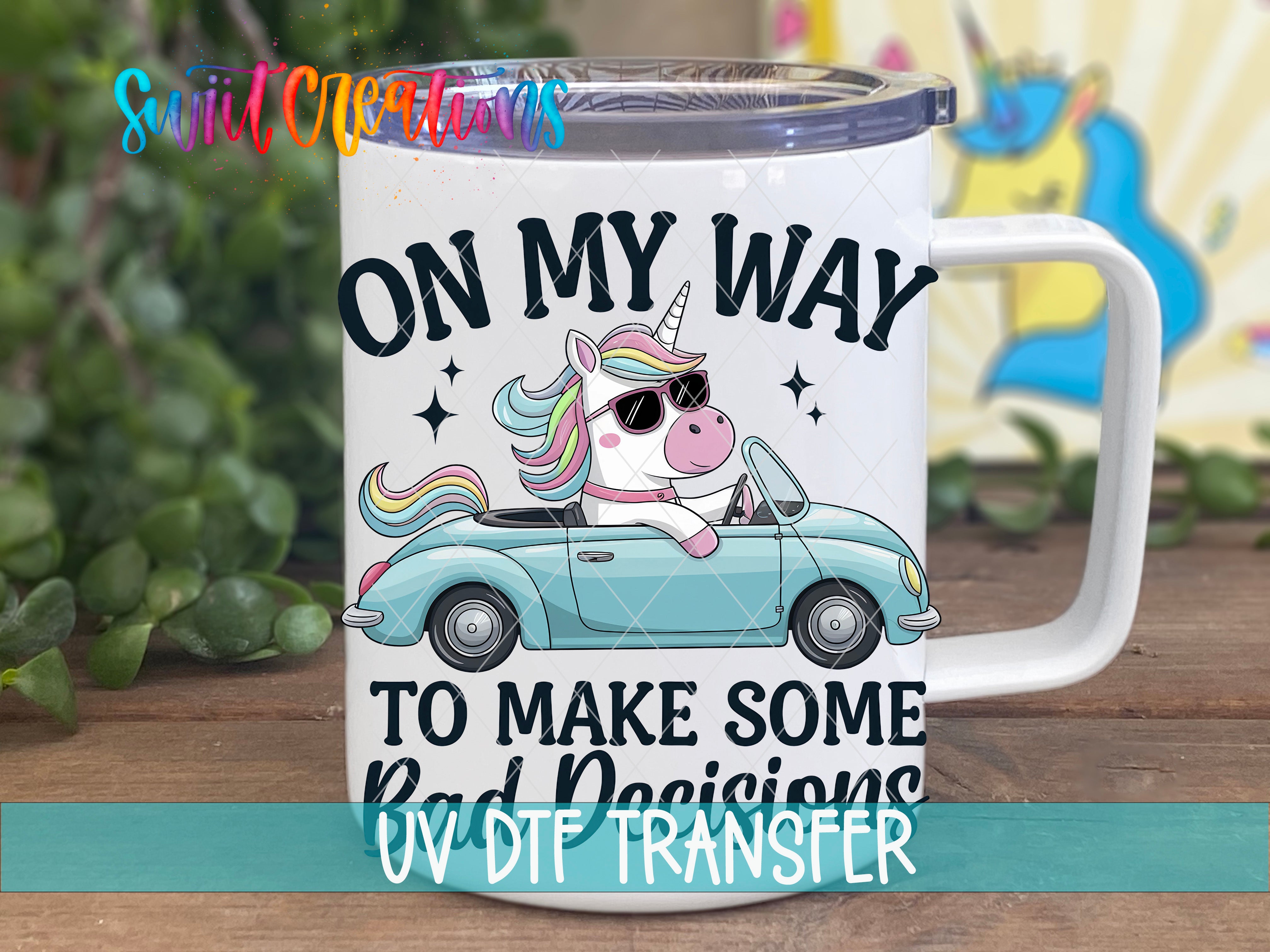 A white mug with a cartoon unicorn and the text "ON MY WAY TO MAKE SOME BAD DECISIONS" printed on it.