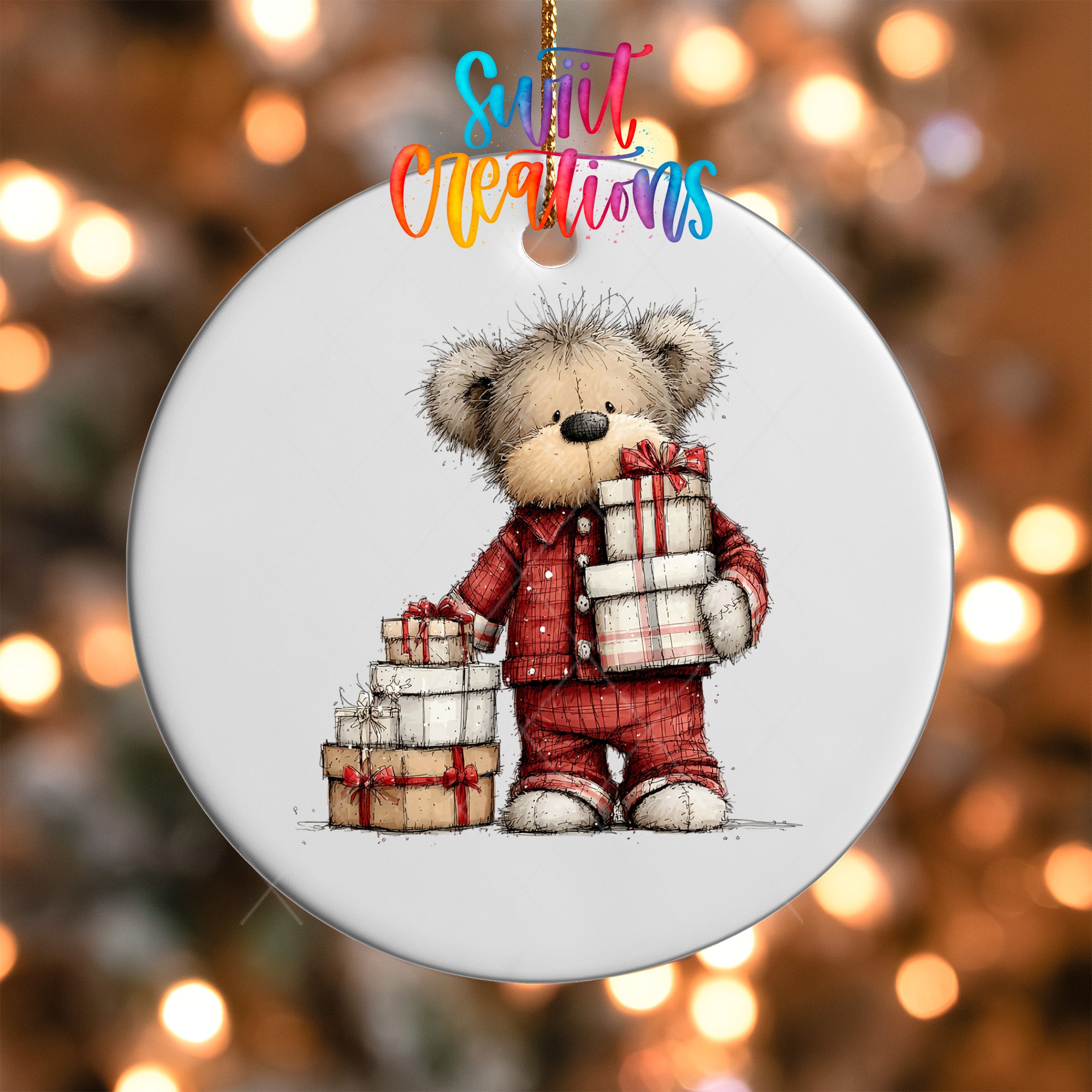 A white ornament featuring a teddy bear holding a stack of wrapped presents.