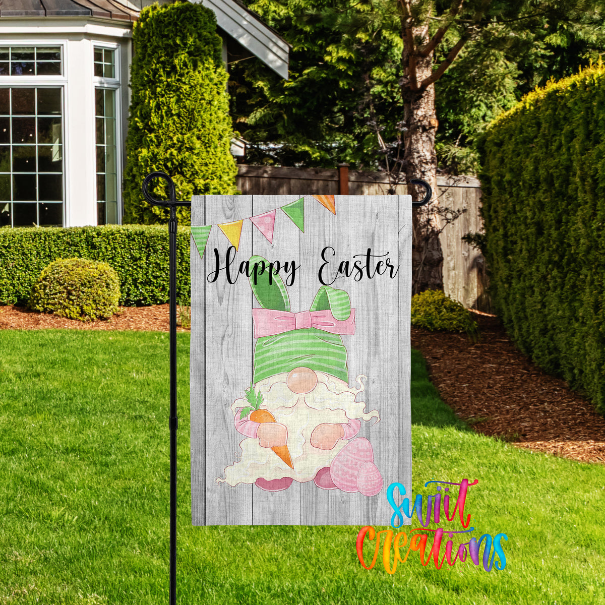 A wooden Easter-themed garden sign with a gnome and carrots, surrounded by a well-maintained lawn and hedges.