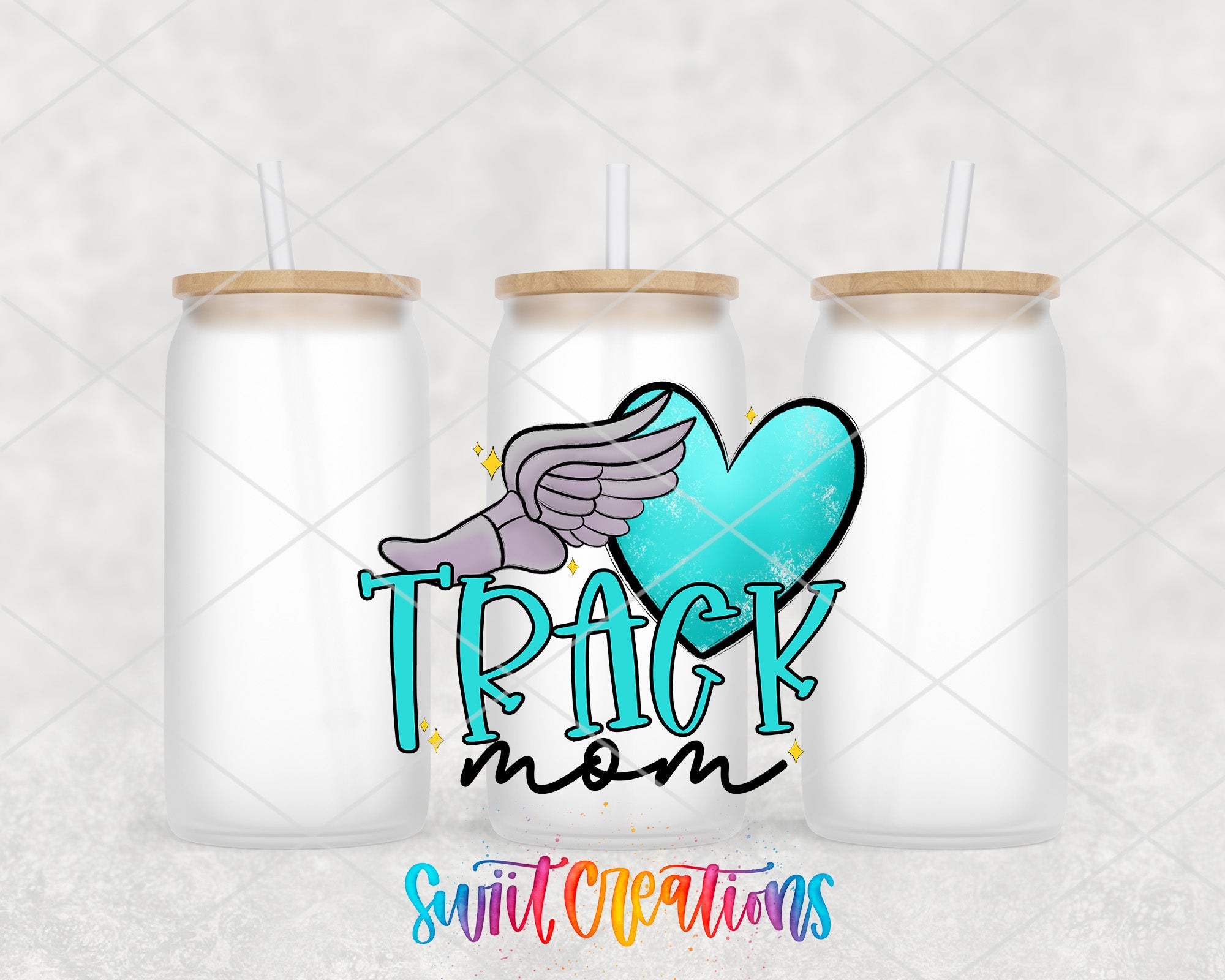 three white glass tumblers with wooden lids, each containing a straw. The tumblers are arranged in a row, and there is a colorful graphic design on the center tumbler that includes a heart, wings, and the word "TRACK" written in a stylized font.