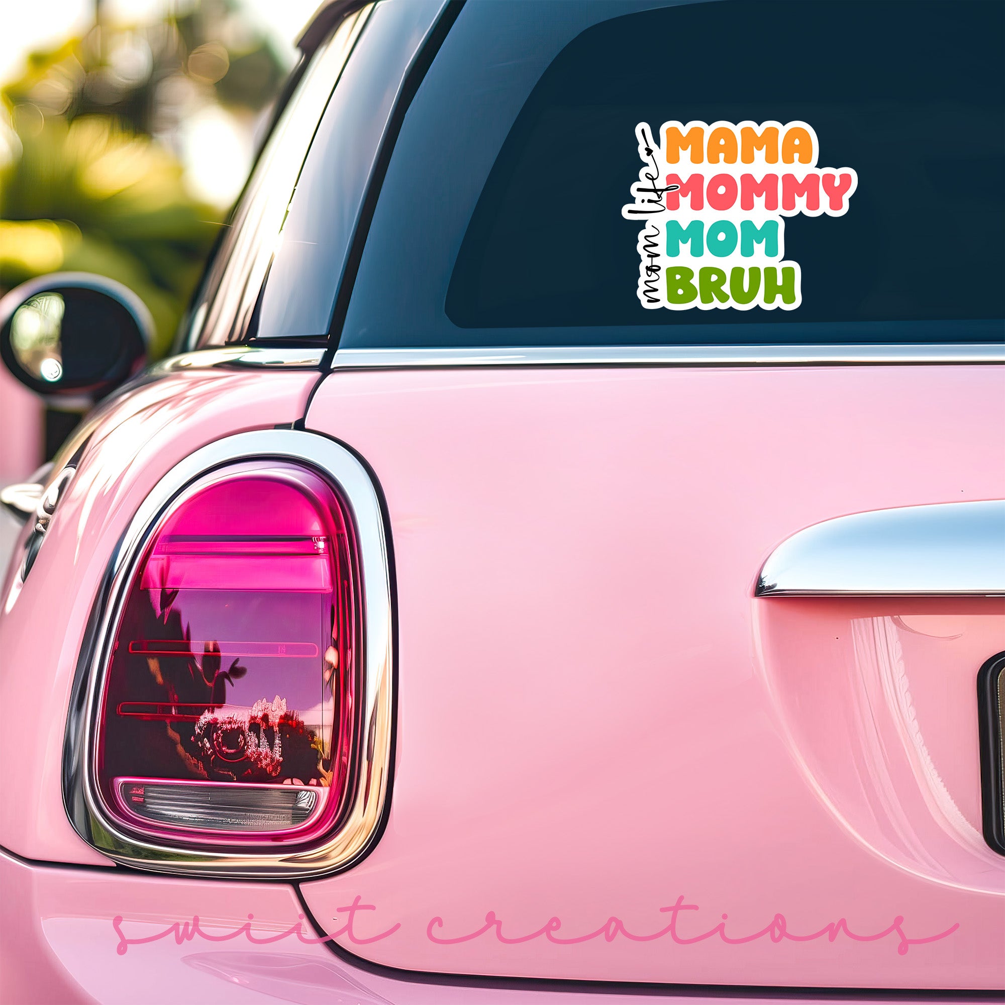 a pink car with a sticker on it