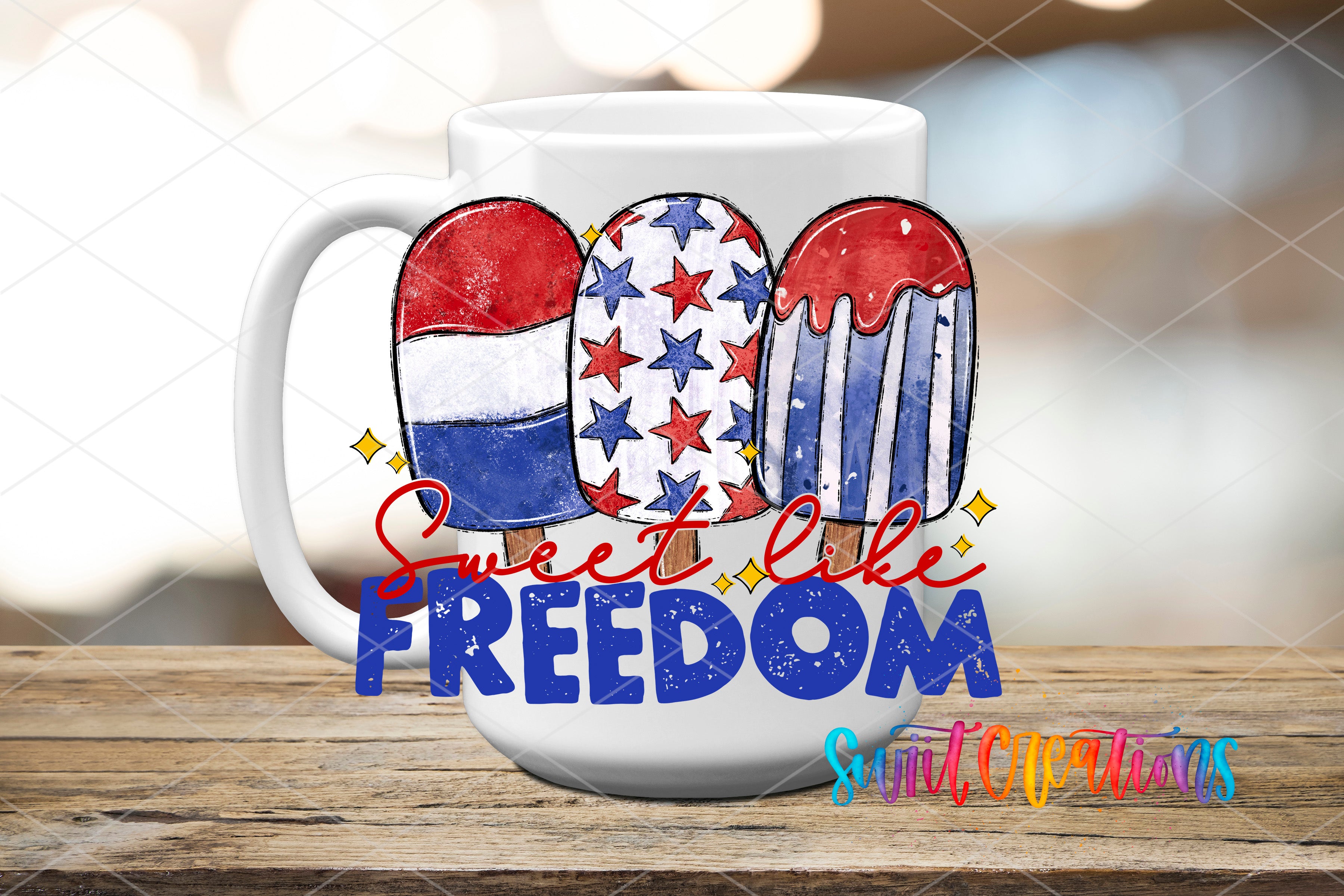 A white mug with a patriotic design featuring three popsicles in red, white, and blue colors, along with the text "Sweet like freedom" and "Suit Creations" printed on it.