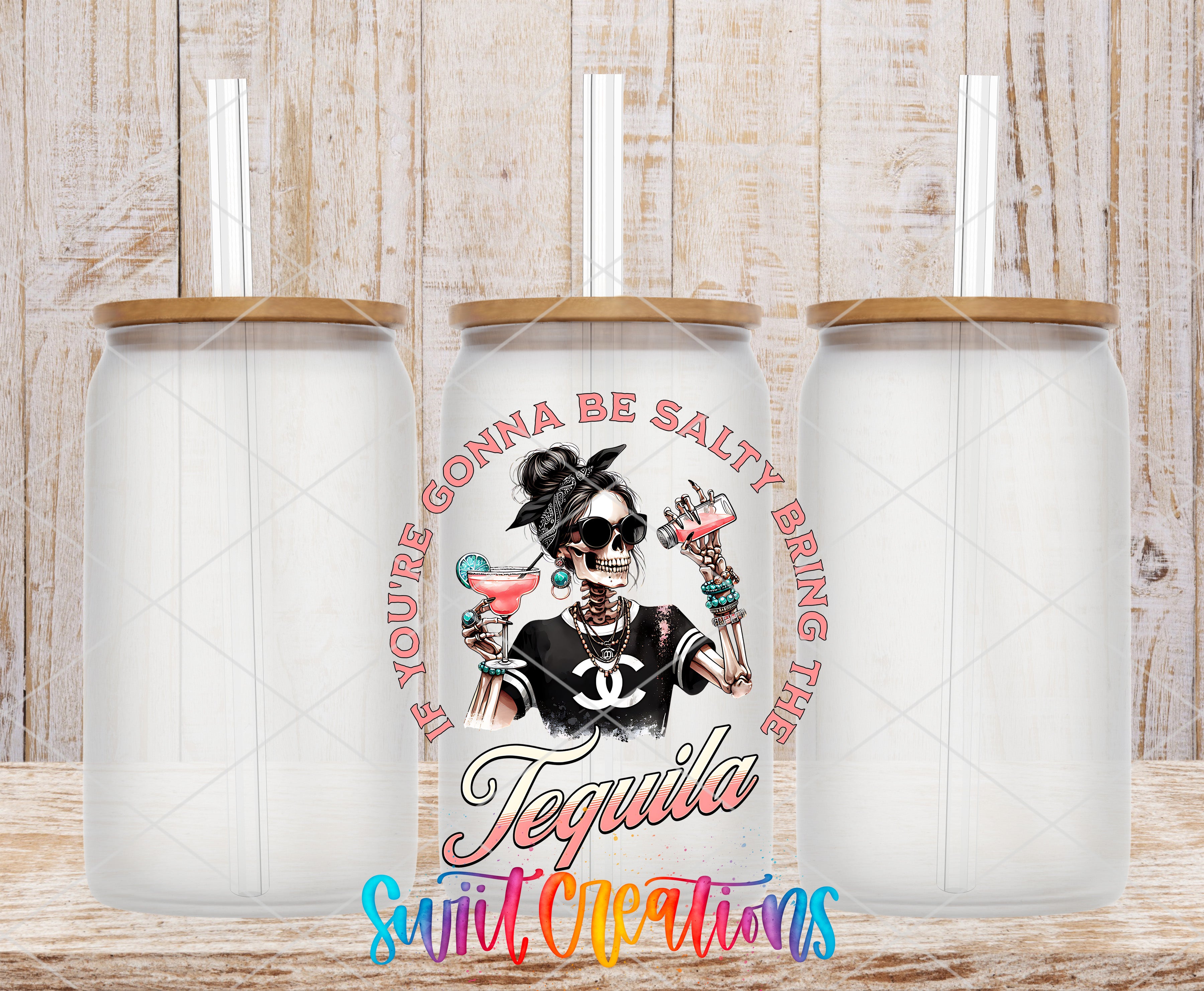 a white ceramic mug with a colorful design and text, placed on a wooden surface.