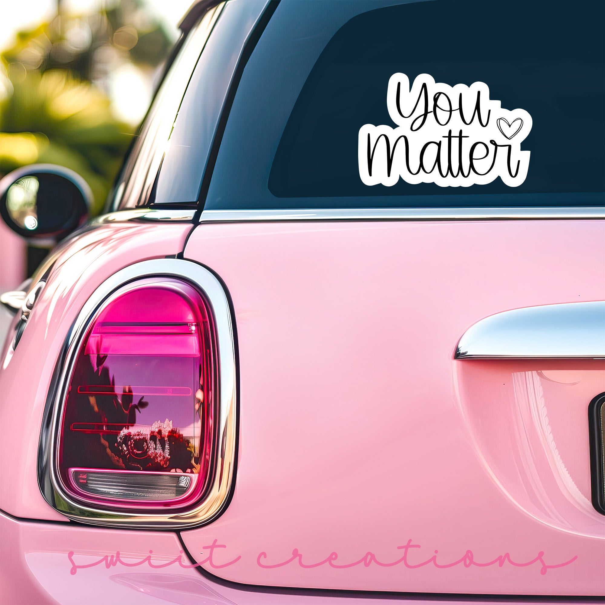 a pink car with a sticker that says you matter