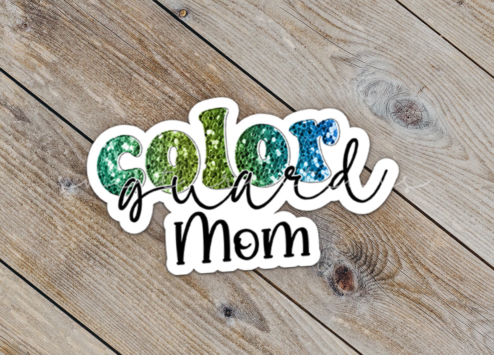 a close up of a sticker on a wooden surface