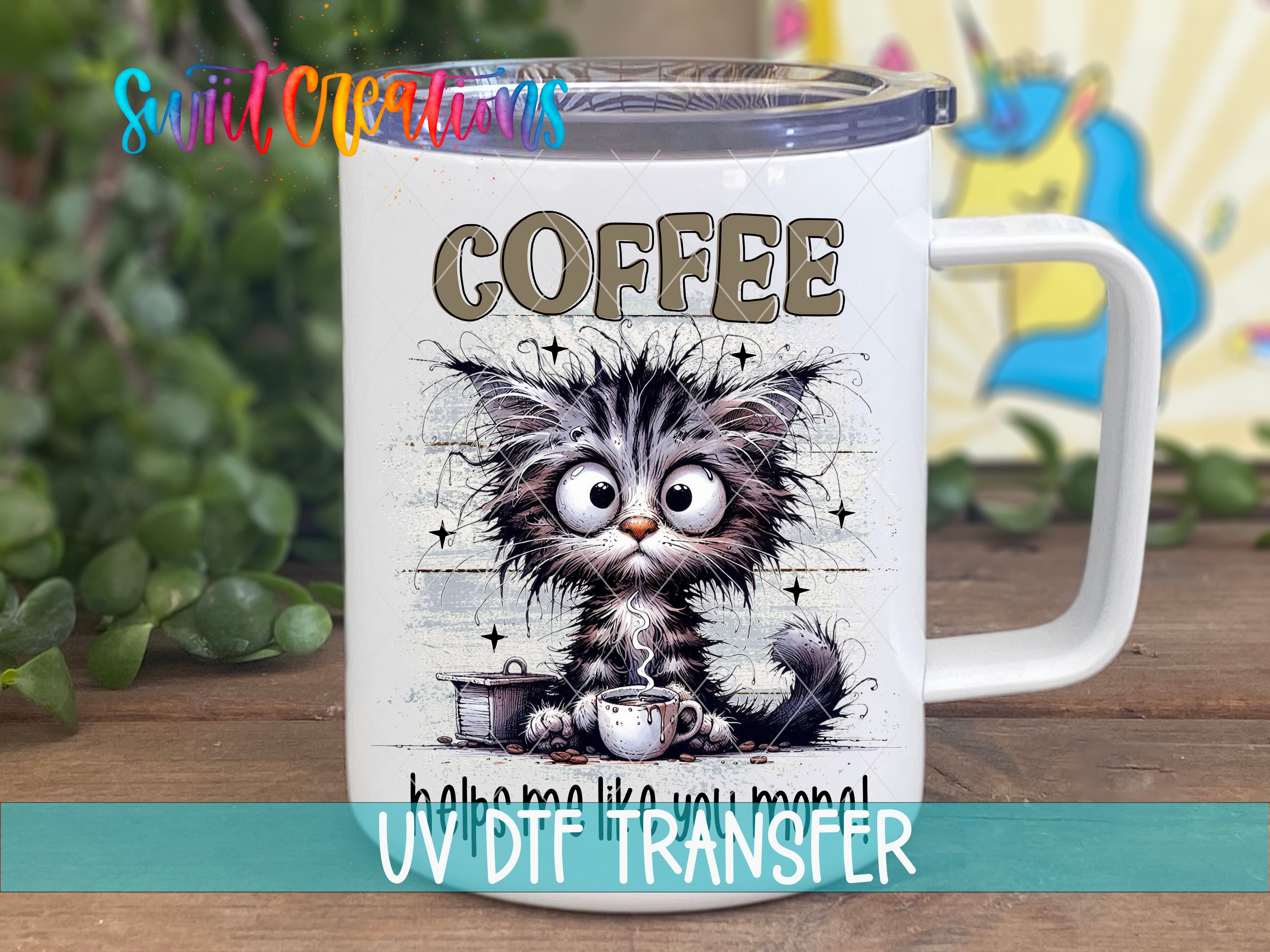 A white mug with a cat illustration and the word "COFFEE" printed on it.