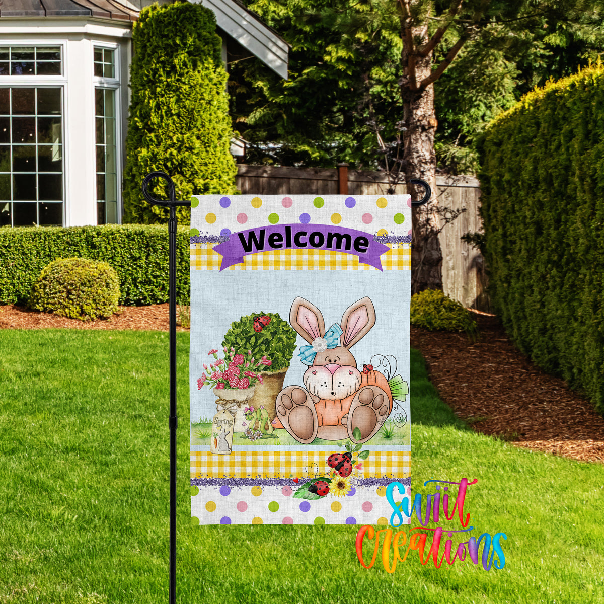 A colorful garden sign welcoming visitors to a backyard with a bunny illustration and flowers.