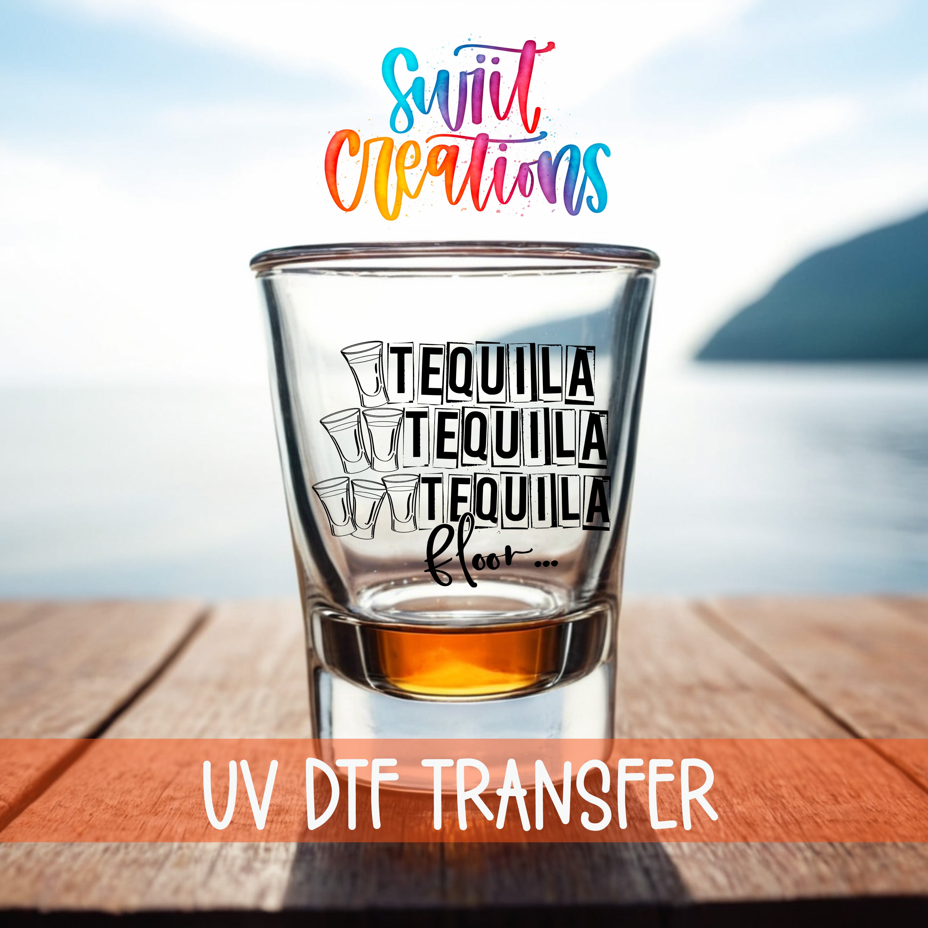 A shot glass with the text "TEQUILA TEQUILA TEQUILA FLOY..." printed on it, placed on a wooden surface with a body of water in the background.