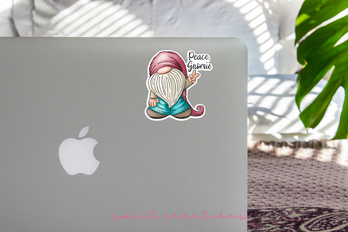 a laptop with a sticker of a gnome on it