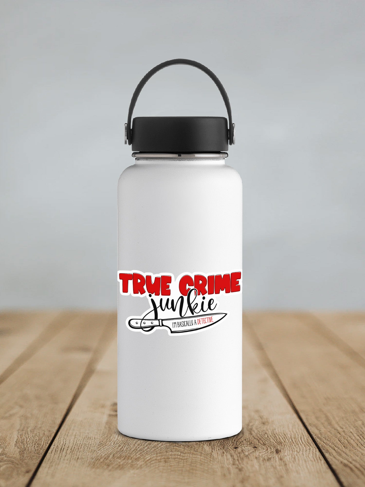 a white water bottle sitting on top of a wooden table