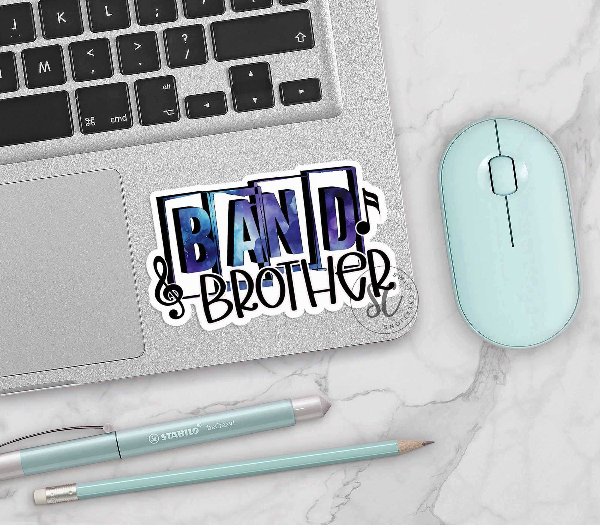 a laptop computer sitting next to a mouse and keyboard