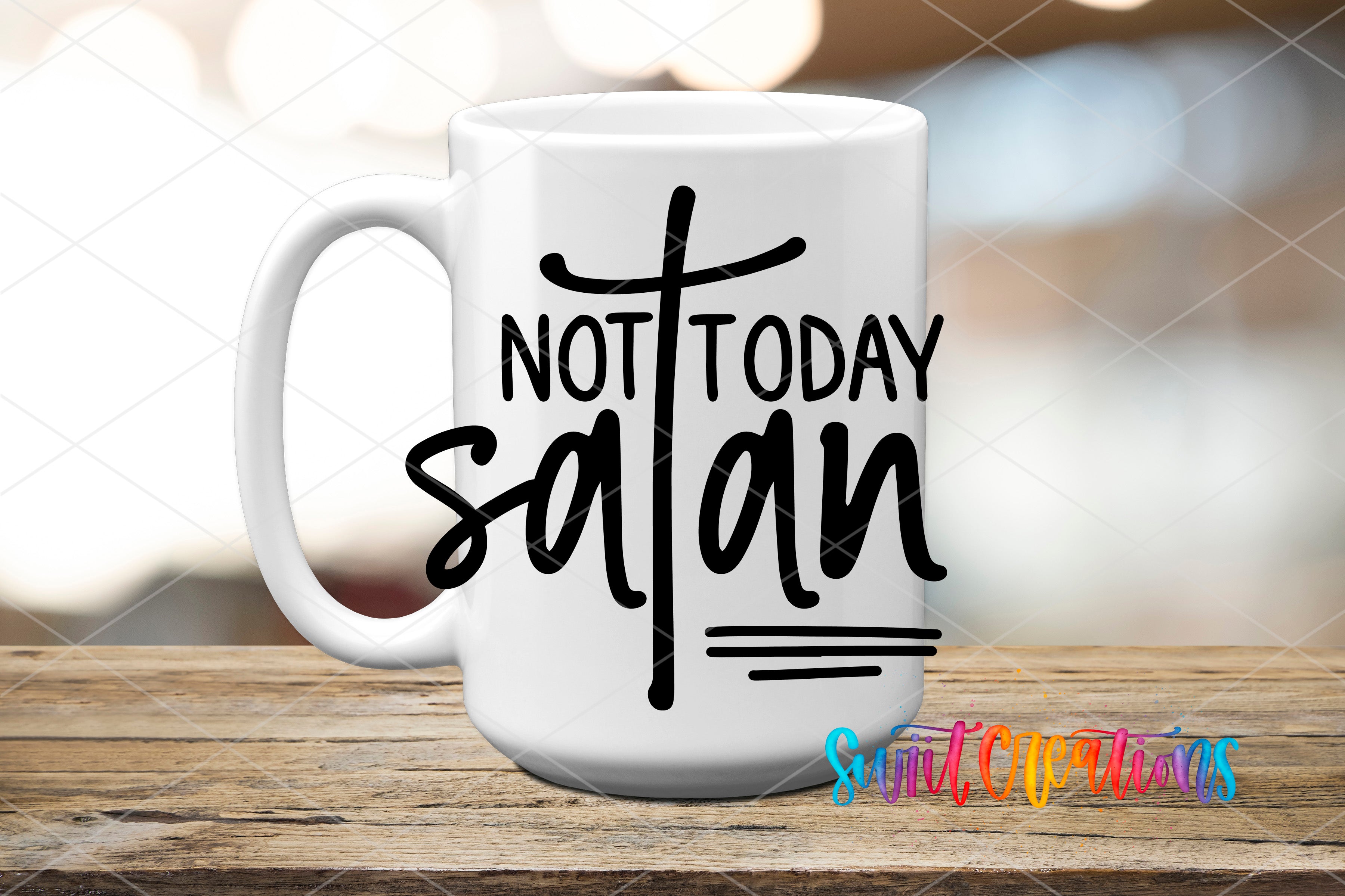 A white ceramic mug with the text "NOT TODAY SATAN" printed on it, placed on a wooden surface.
