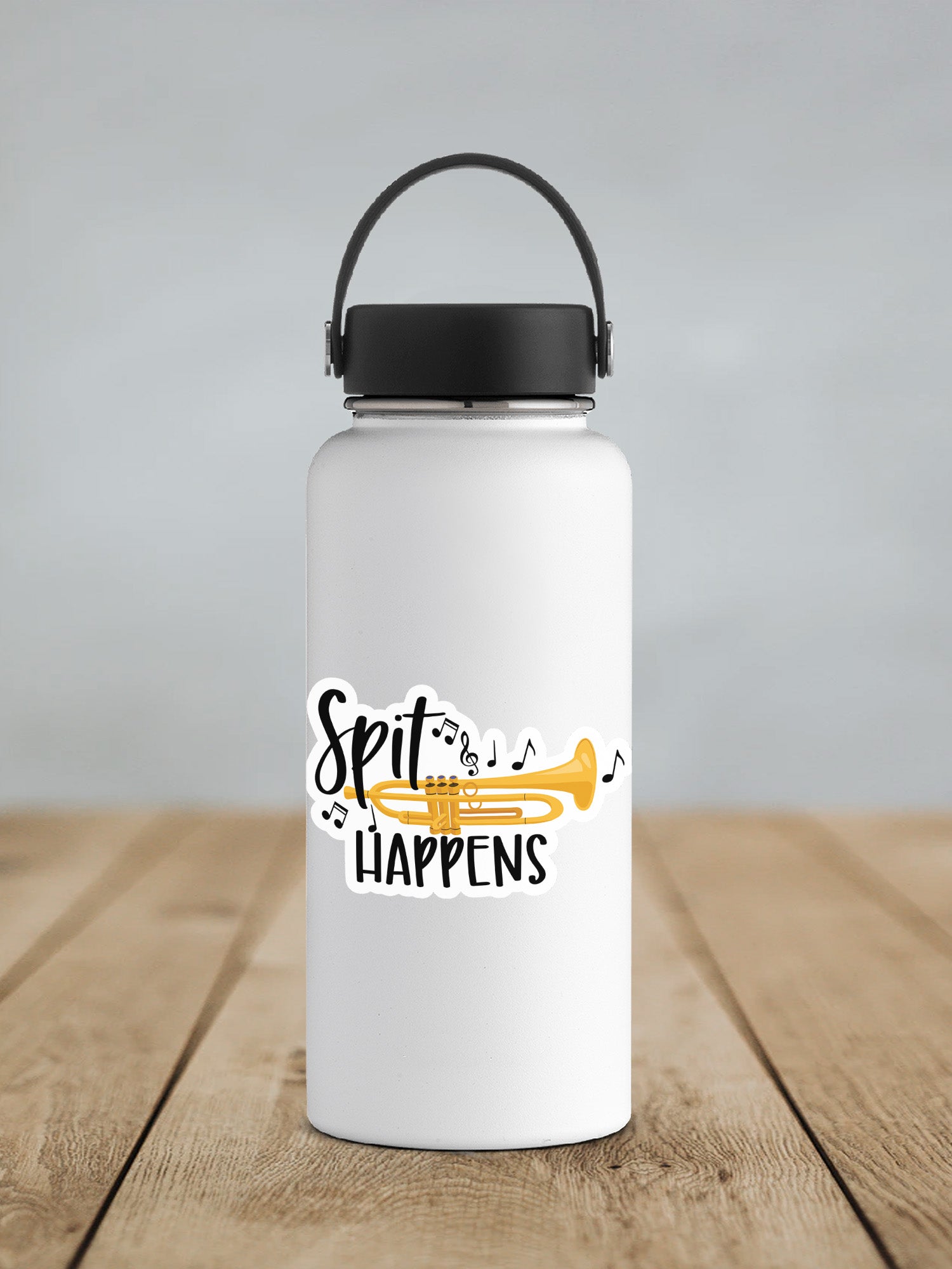 a white water bottle sitting on top of a wooden table